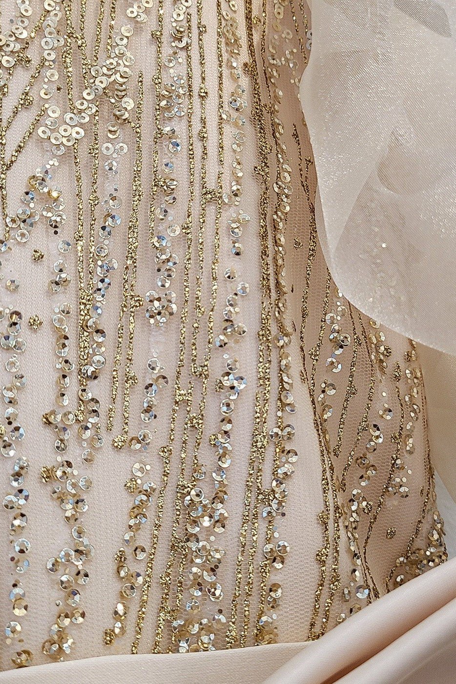 Champagne USA Made | Glittering Sequin bodice Luxurious Tulle with Organza Bubble Sleeve Tea-length flower girl dress - zoomed in view of dress showing pattern and details.