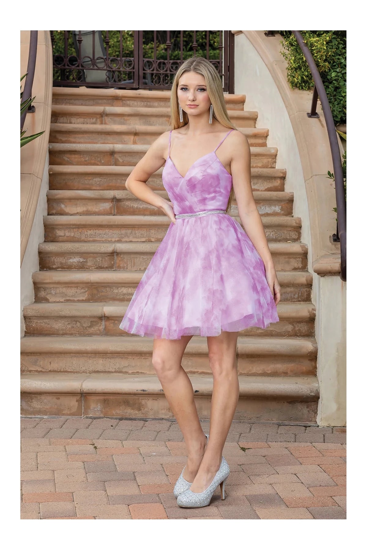Featuring an above-knee hem, this Pink homecoming dress is shown in full view.
