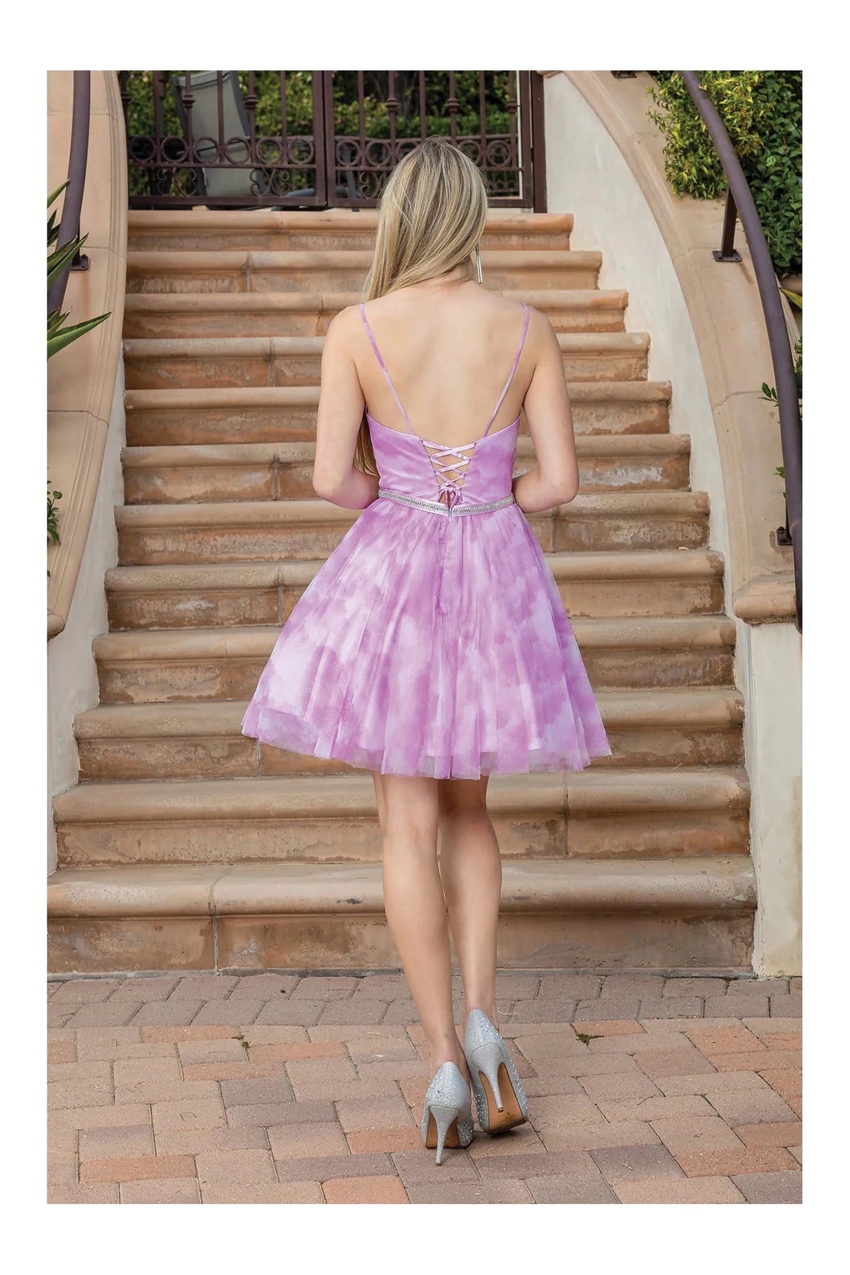 From the back, the Pink homecoming dress reveals its above-knee hem.