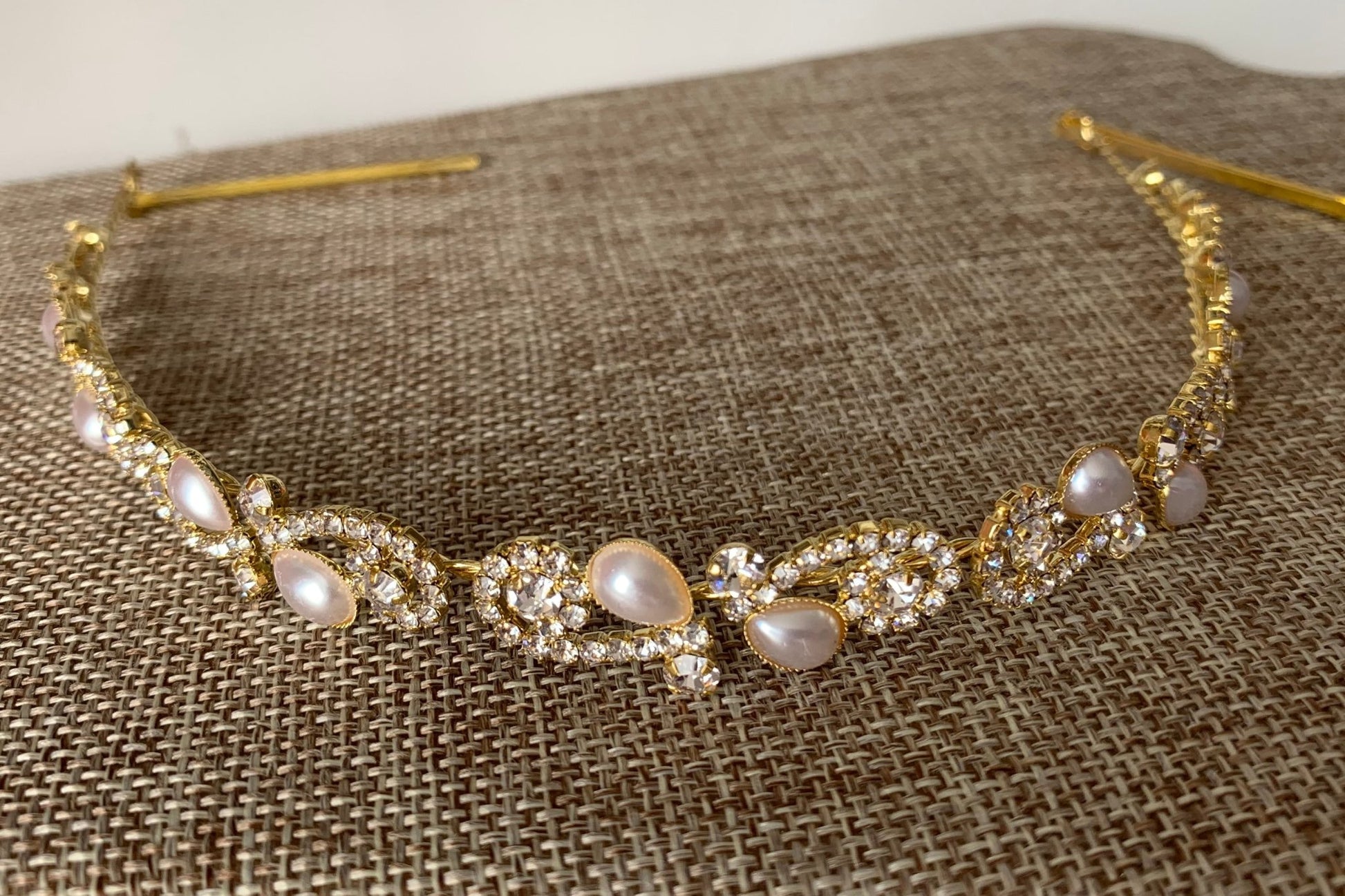 Gold pearl rhinestone bridal headpiece or sash belt, front view.