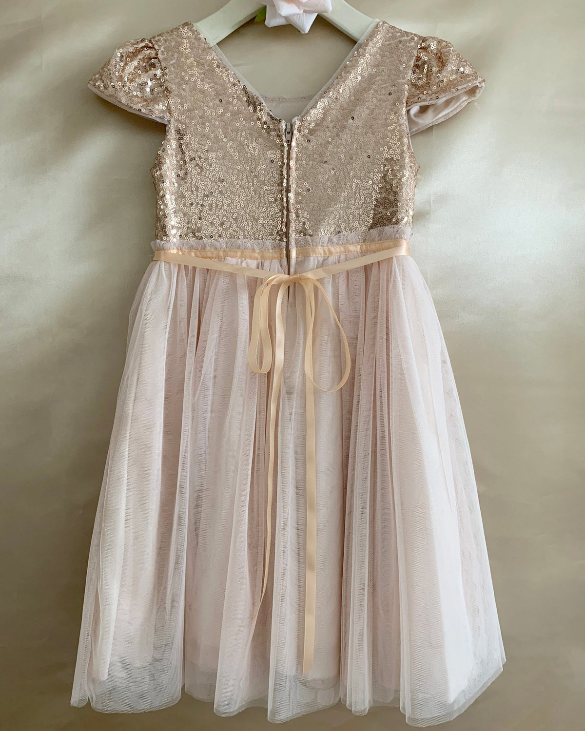 super soft mesh layered flower girl dress with lace-up bodice, sequin detailing, cap sleeves, and layered mesh skirt.