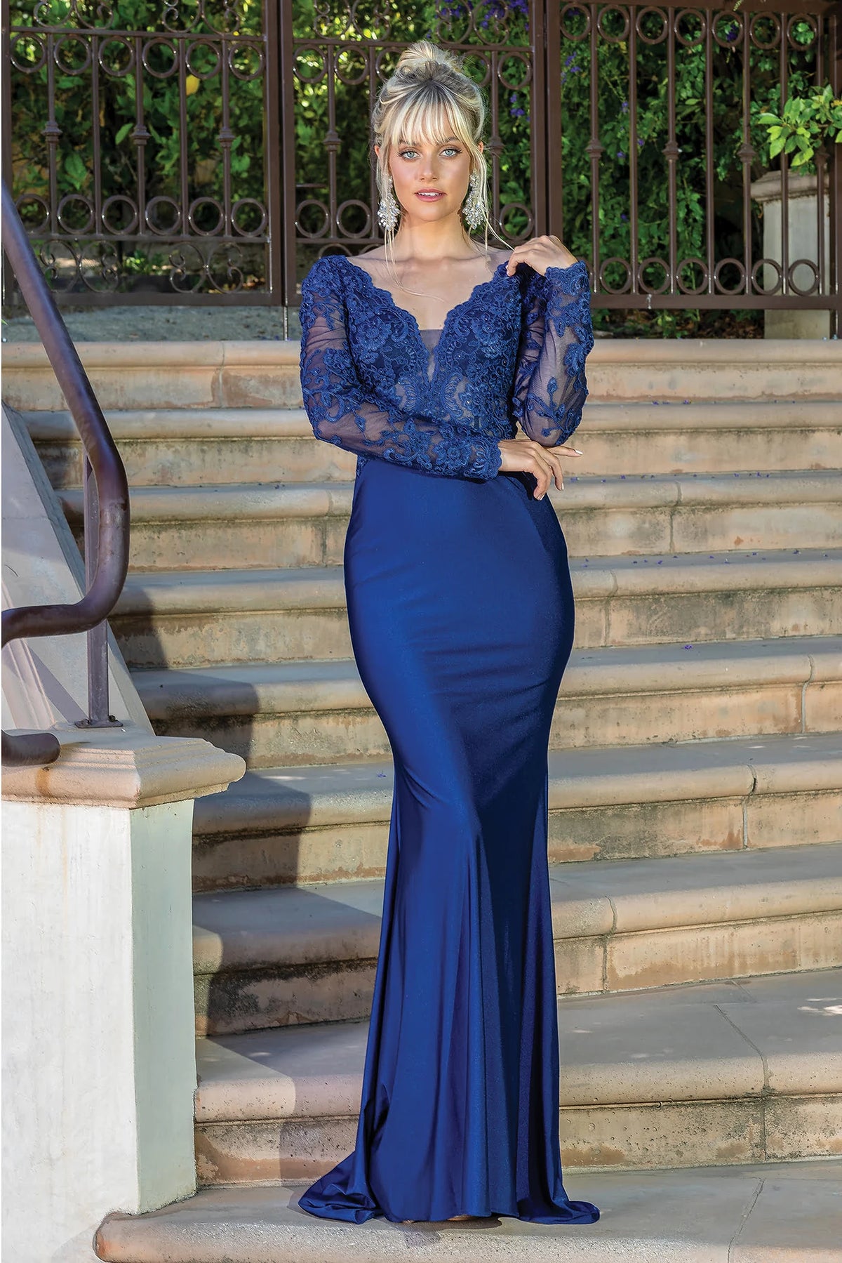 Featuring a floor-length skirt, this Navy prom dress is shown in full view.
