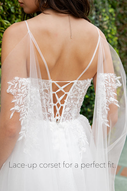 White lace-up corset with a matching veil against a blurred green background