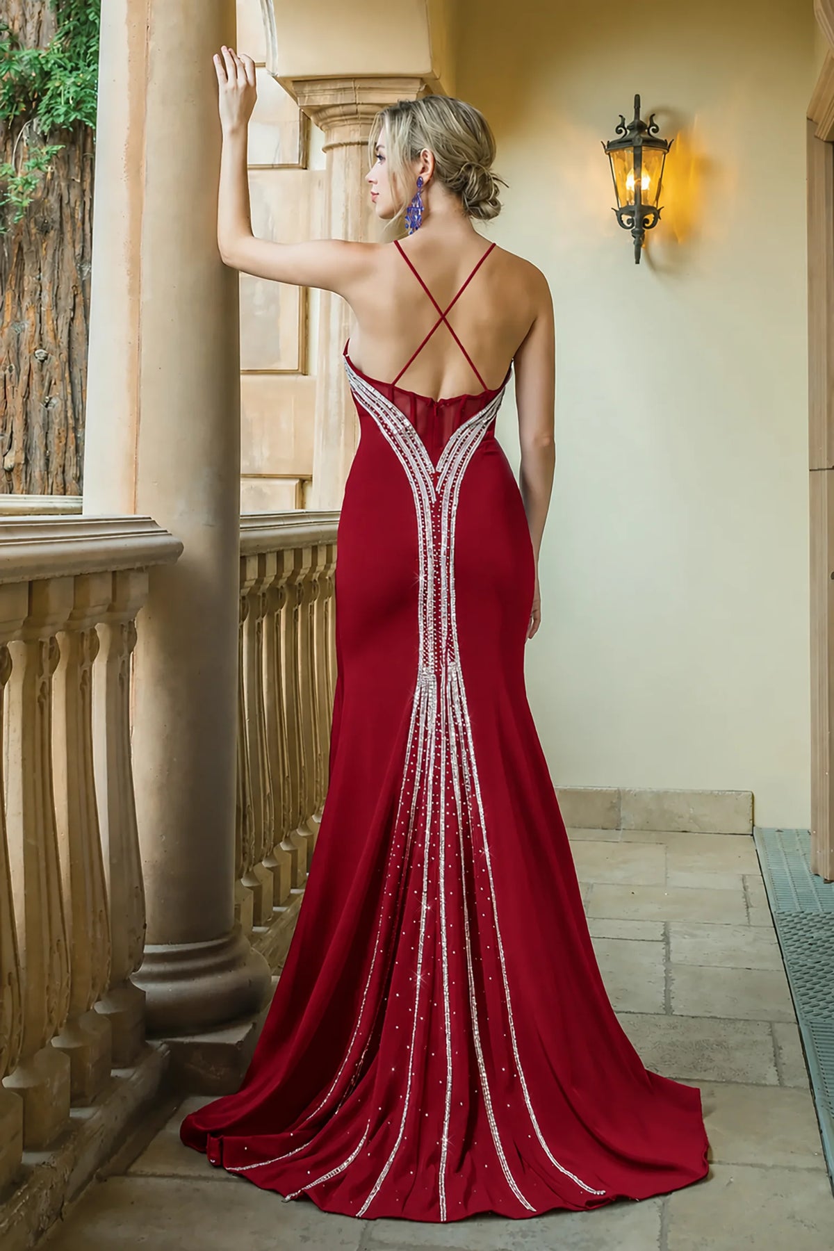 Open back with beaded edging completes the Burgundy Beaded Prom Dress.