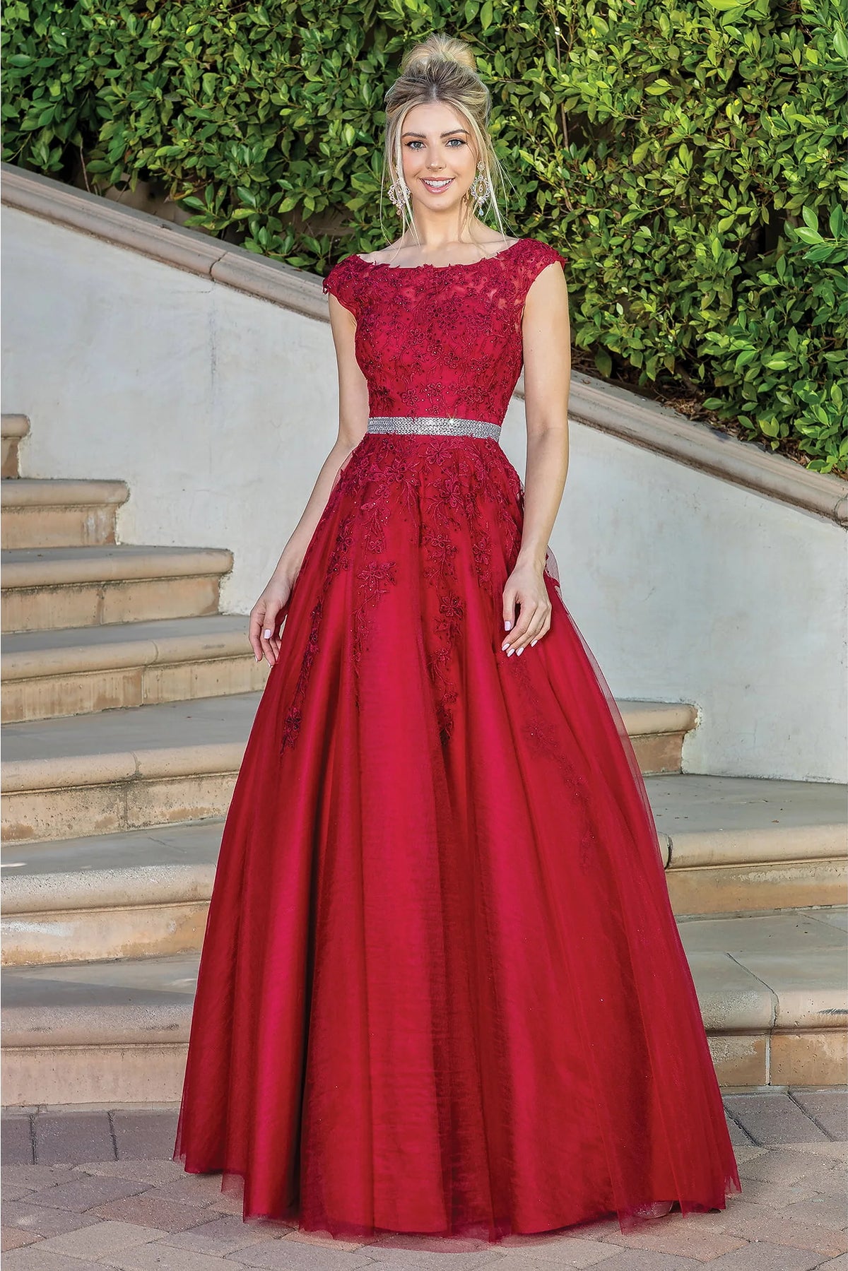 Featuring a floor-length skirt, this Burgundy prom dress is shown in full view.