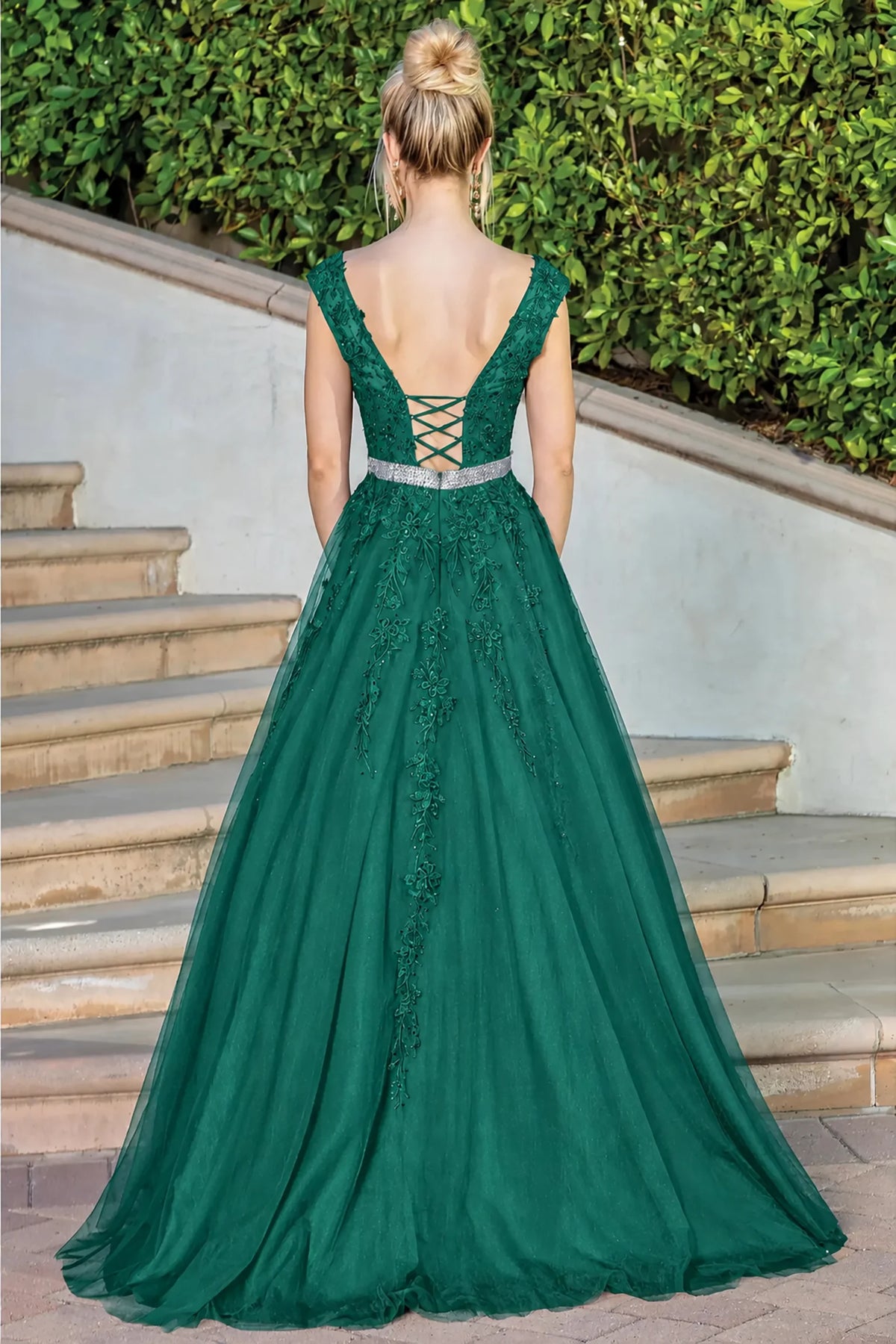 Lace-up back and flowing skirt complete the Hunter Green Embroidered Prom Dress.