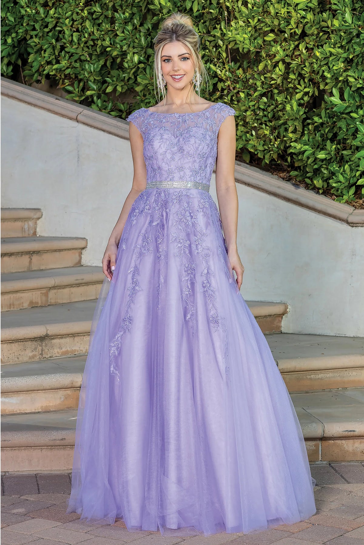Featuring a floor-length skirt, this Lilac prom dress is shown in full view.