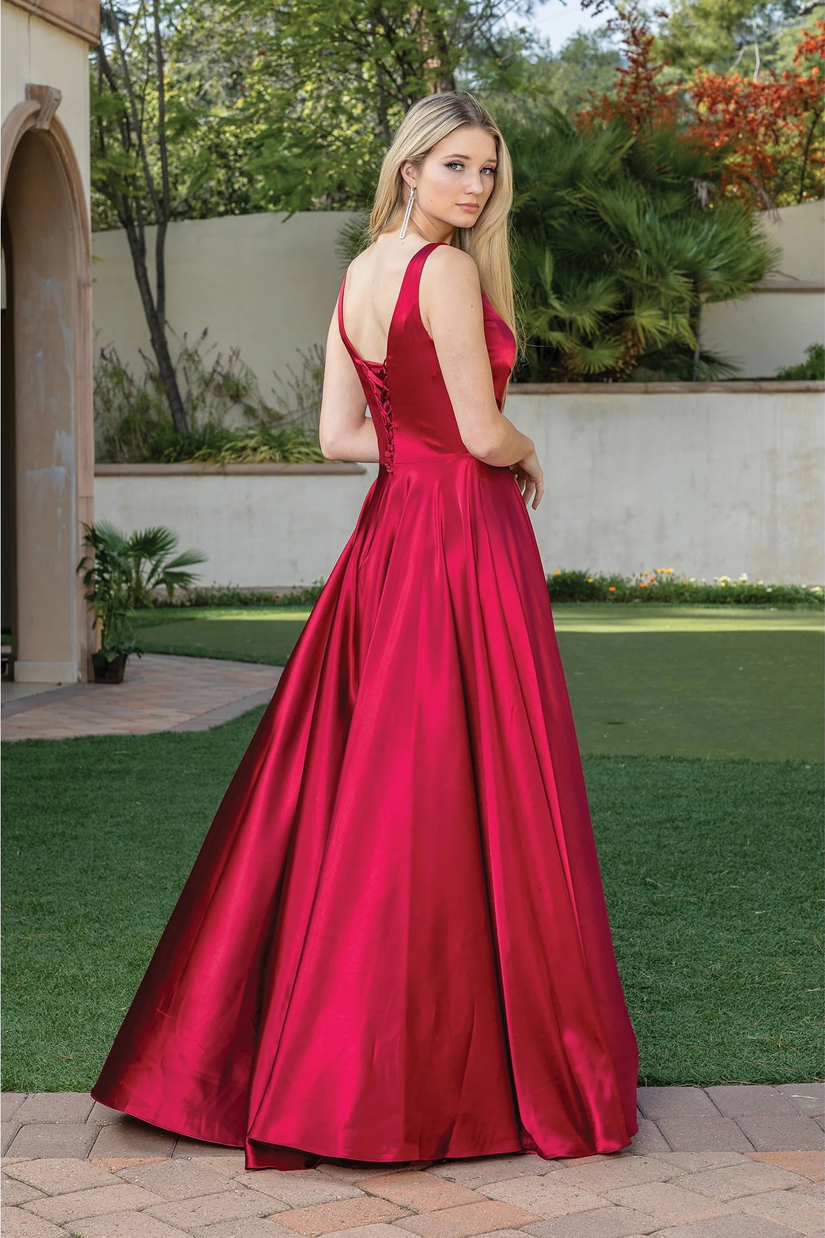 From the back, the Burgundy prom dress reveals its floor-length skirt.