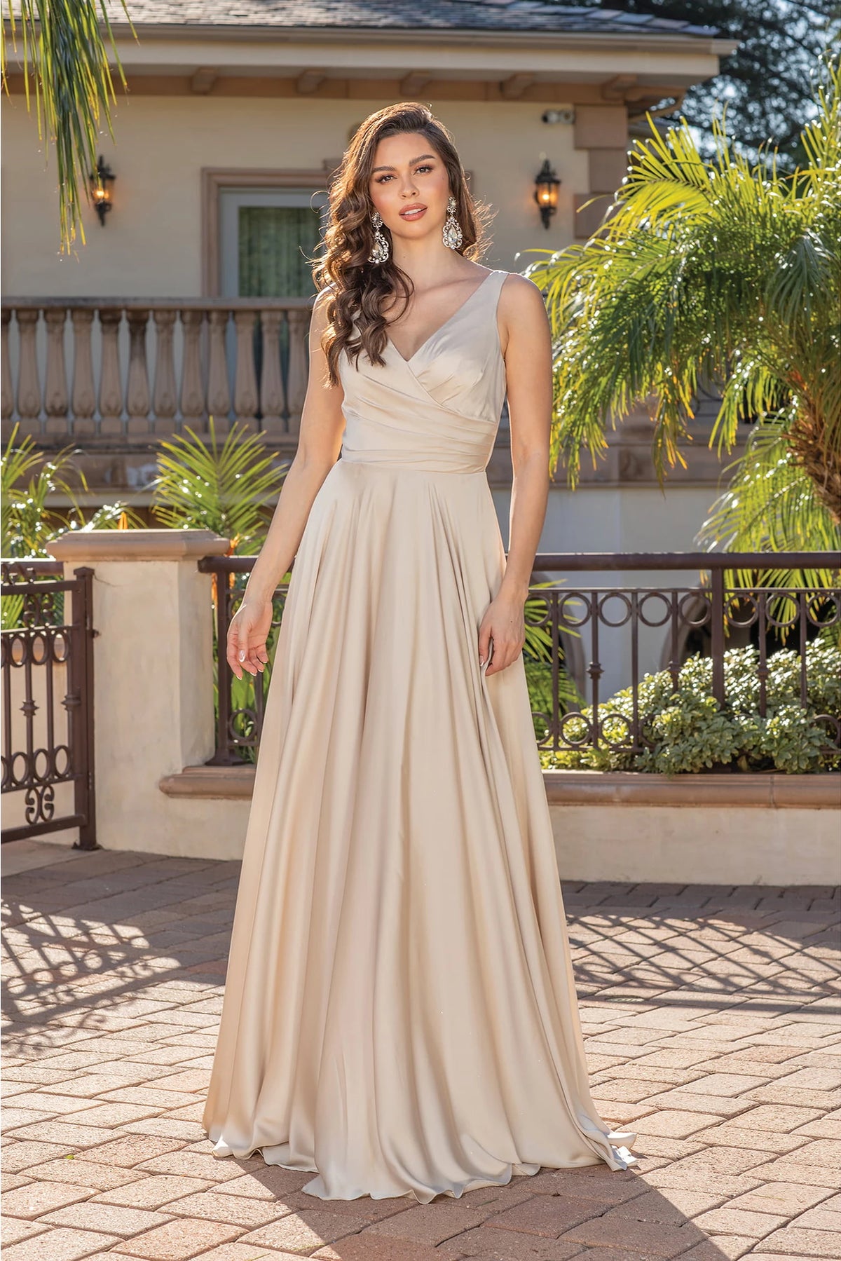 Featuring a floor-length skirt, this Champagne prom dress is shown in full view.