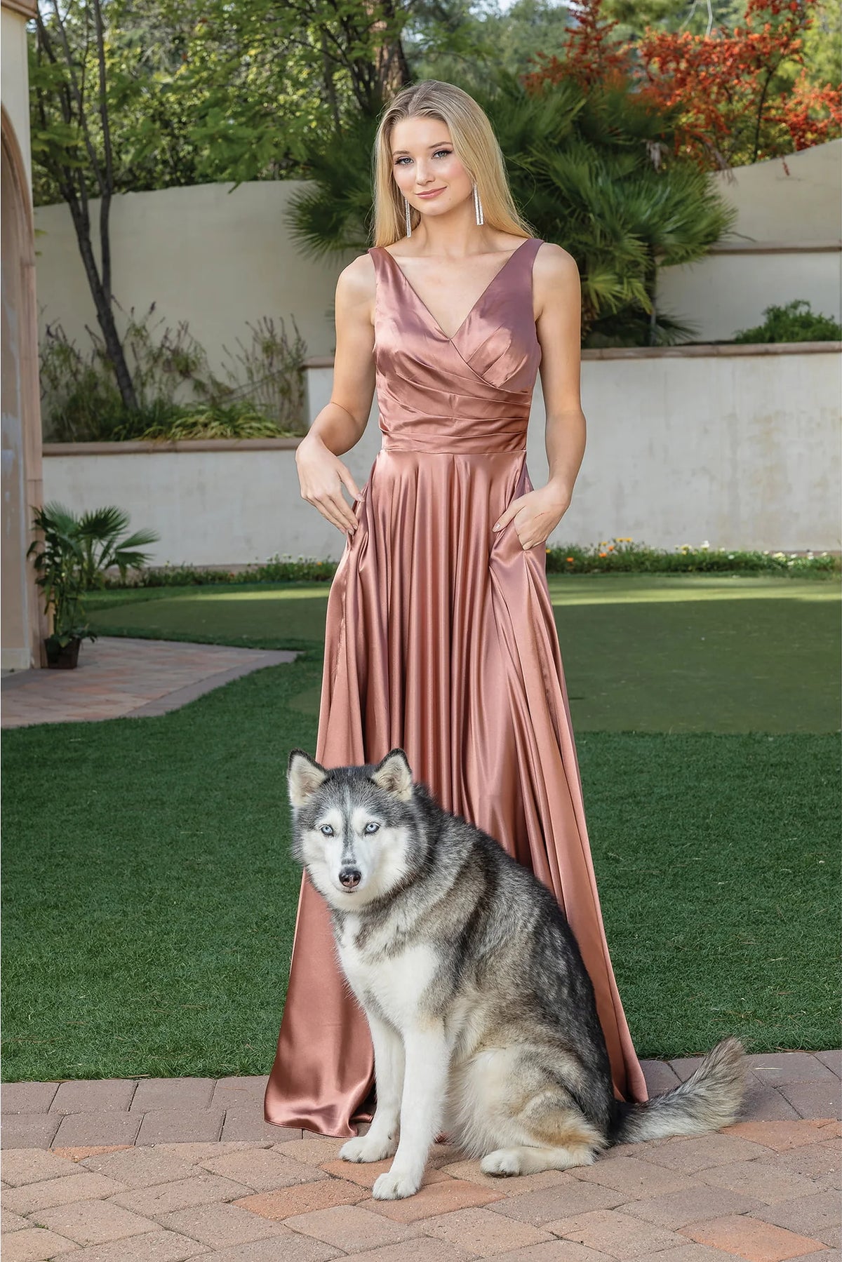 Featuring a floor-length skirt, this Copper prom dress is shown in full view.