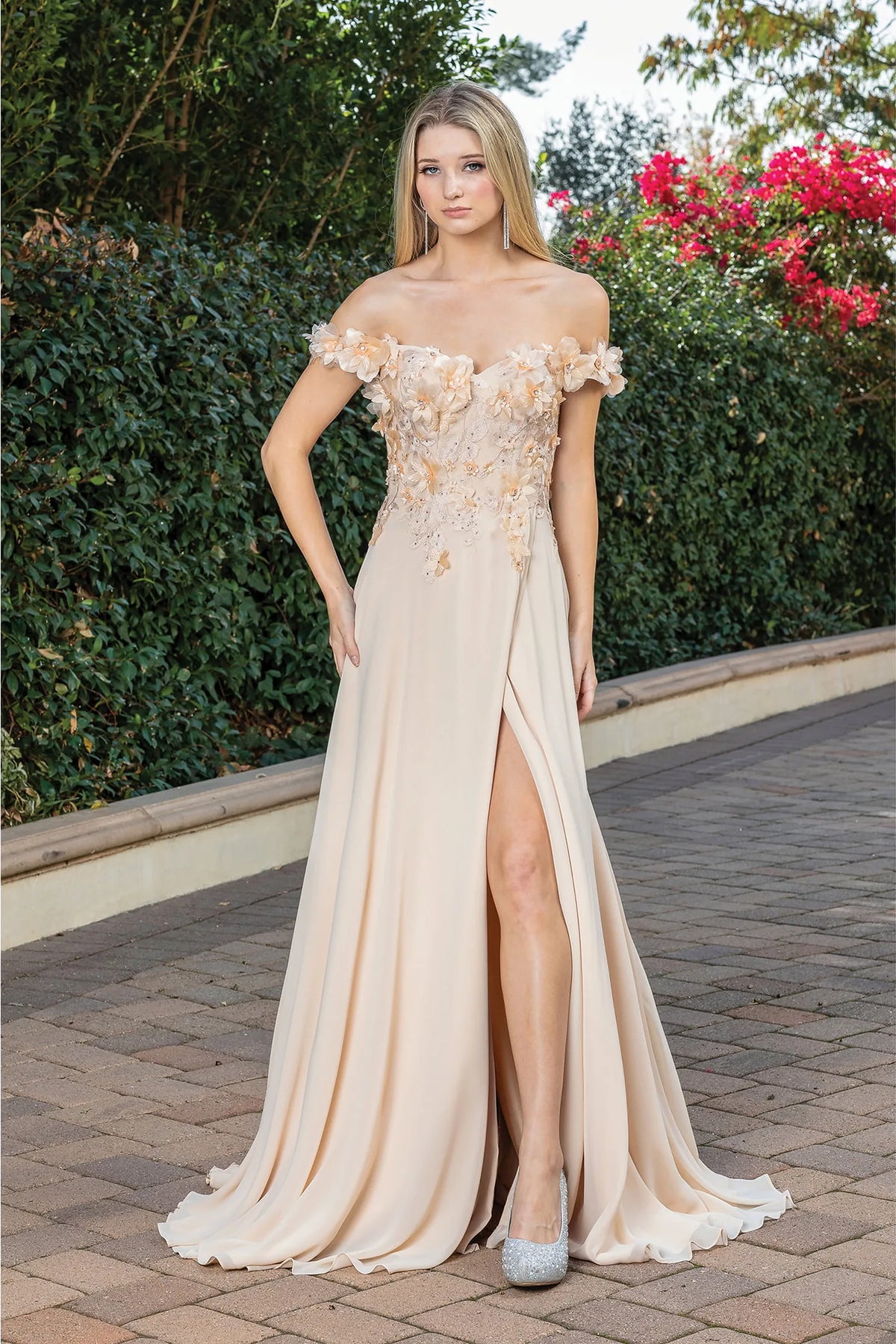 Featuring a floor-length skirt, this Champagne prom dress is shown in full view.
