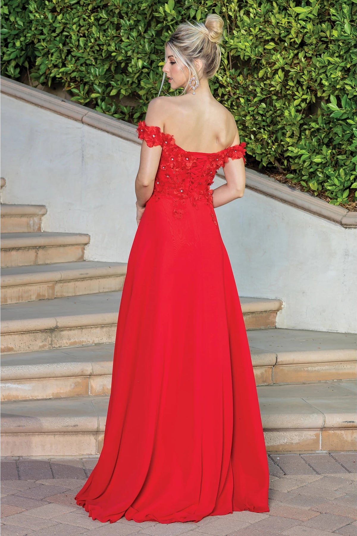 From the back, the Red prom dress reveals its floor-length skirt.