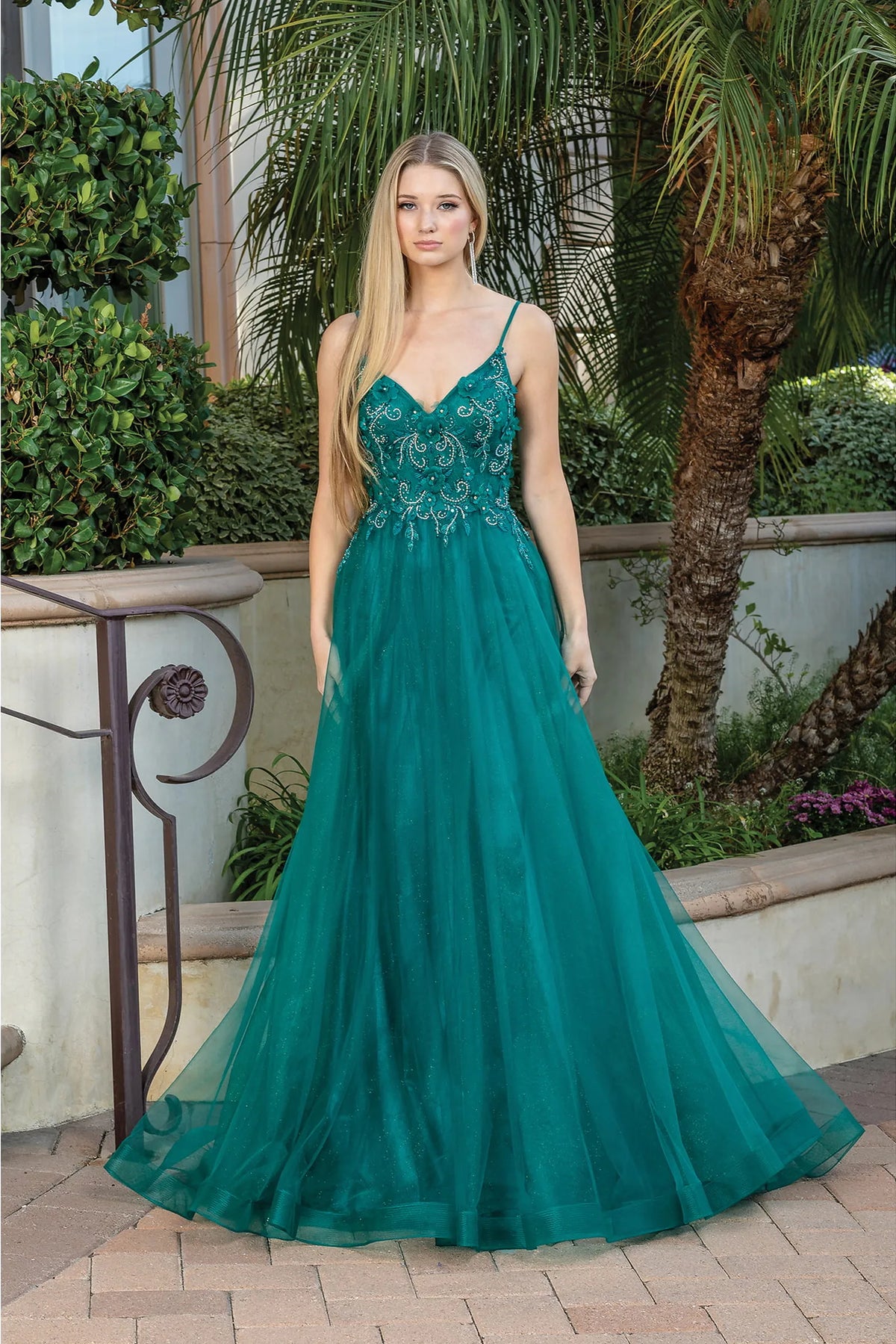 Featuring a floor-length skirt, this Hunter Green prom dress is shown in full view.