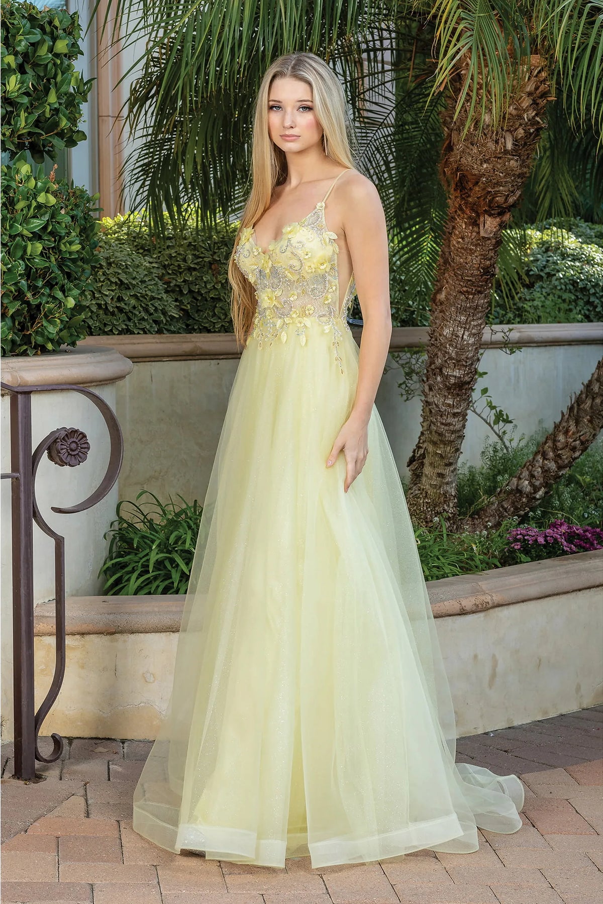 Featuring a floor-length skirt, this Yellow prom dress is shown in full view.