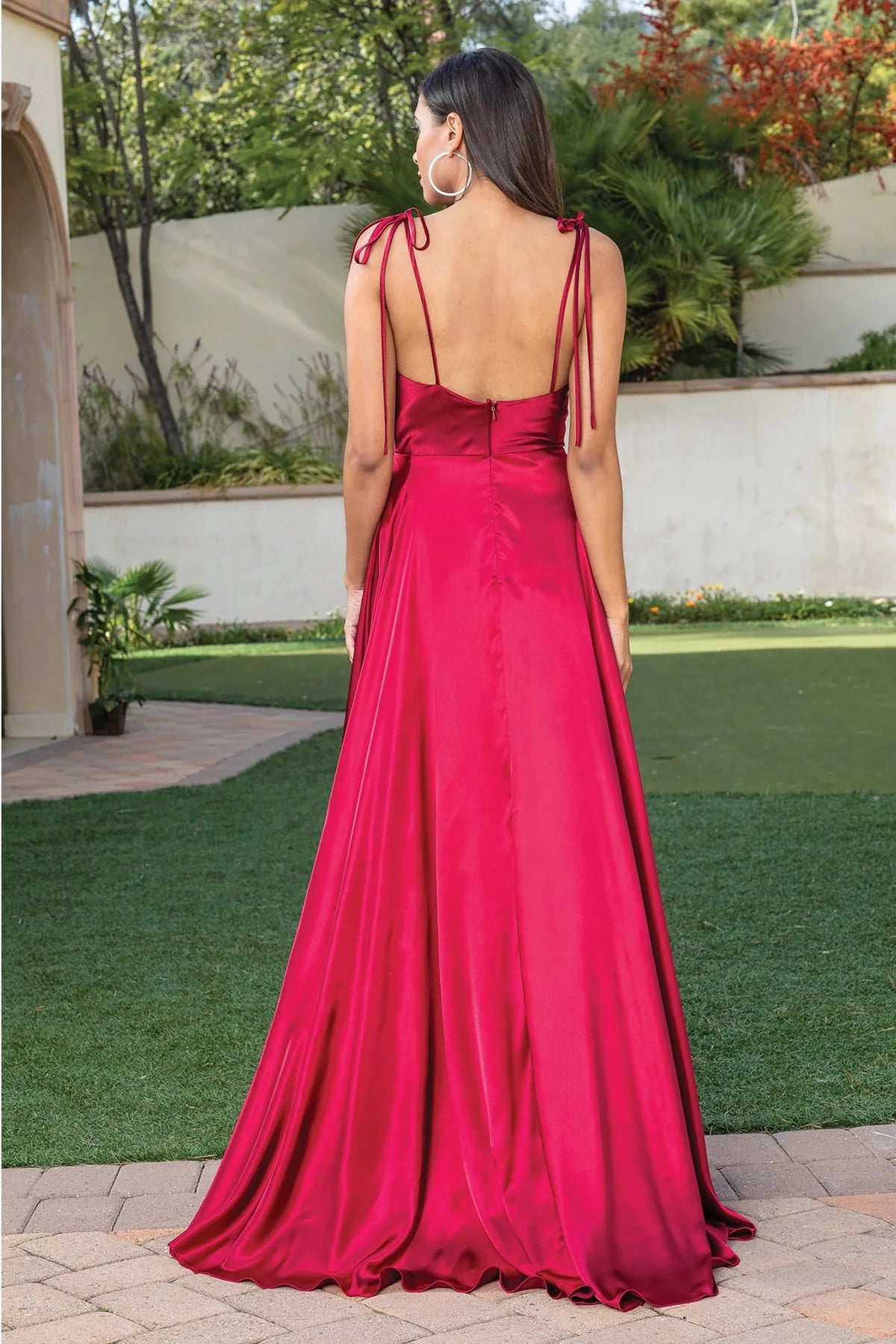 From the back, the Burgundy prom dress reveals its floor-length skirt.
