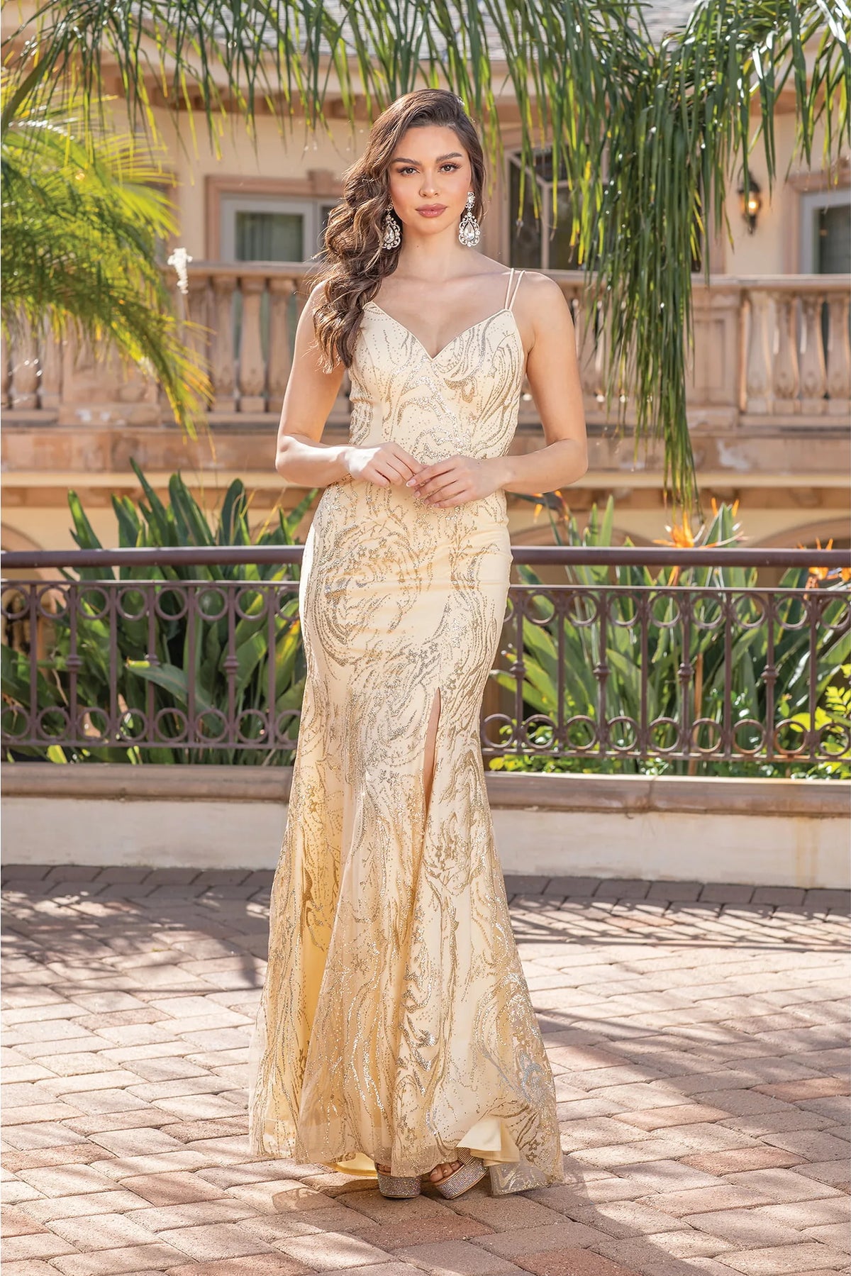 Featuring a floor-length skirt, this Gold prom dress is shown in full view.