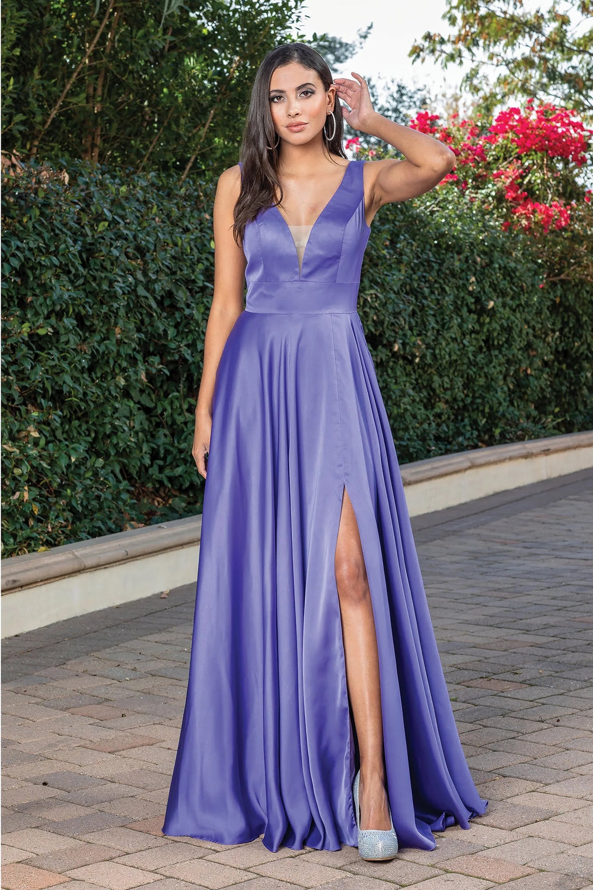 Featuring a floor-length skirt, this Lavendar prom dress is shown in full view.