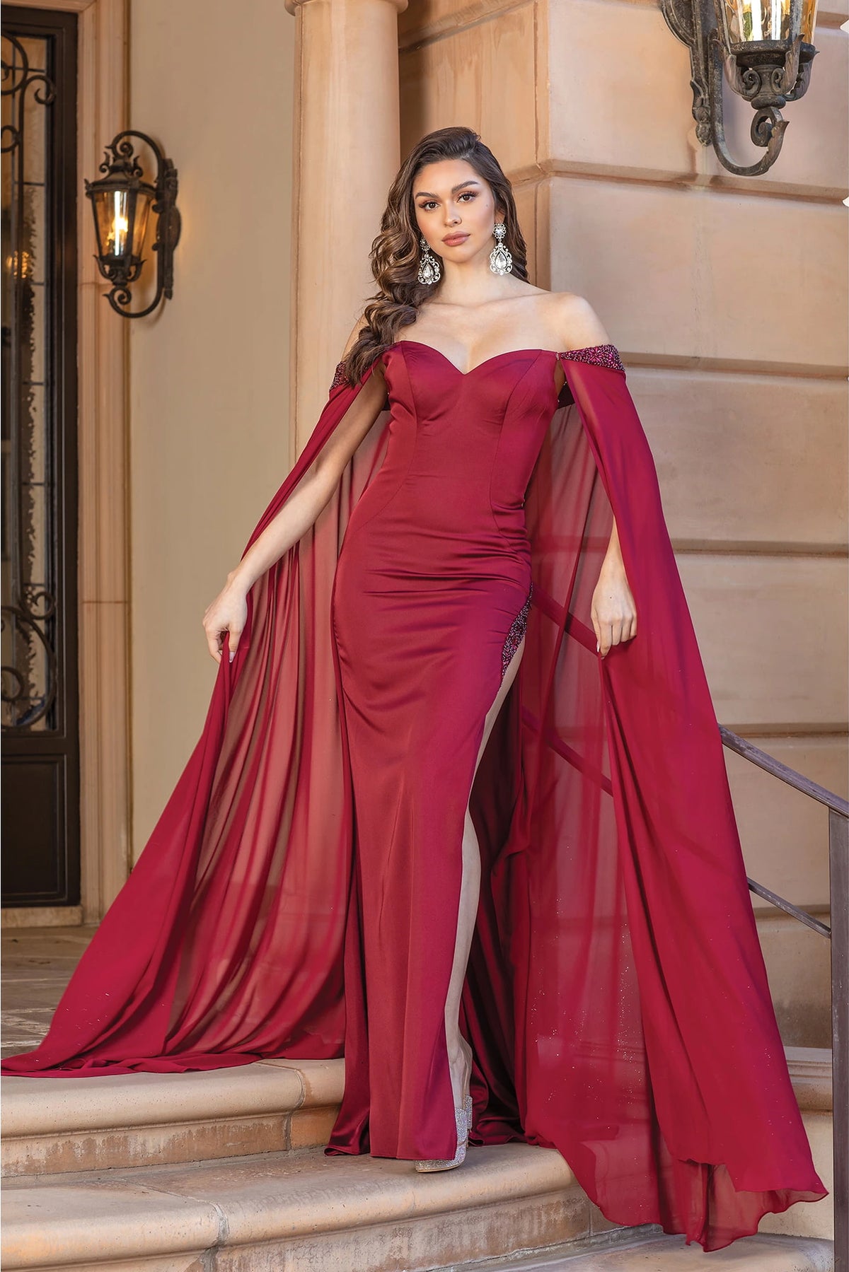 Featuring a floor-length skirt, this Burgundy prom dress is shown in full view.