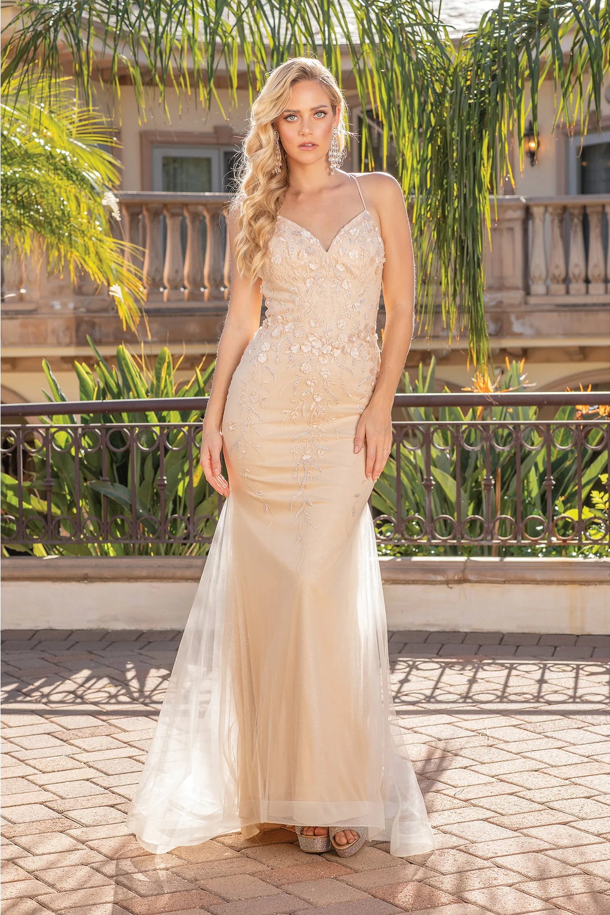 Featuring a floor-length skirt, this Champagne prom dress is shown in full view.