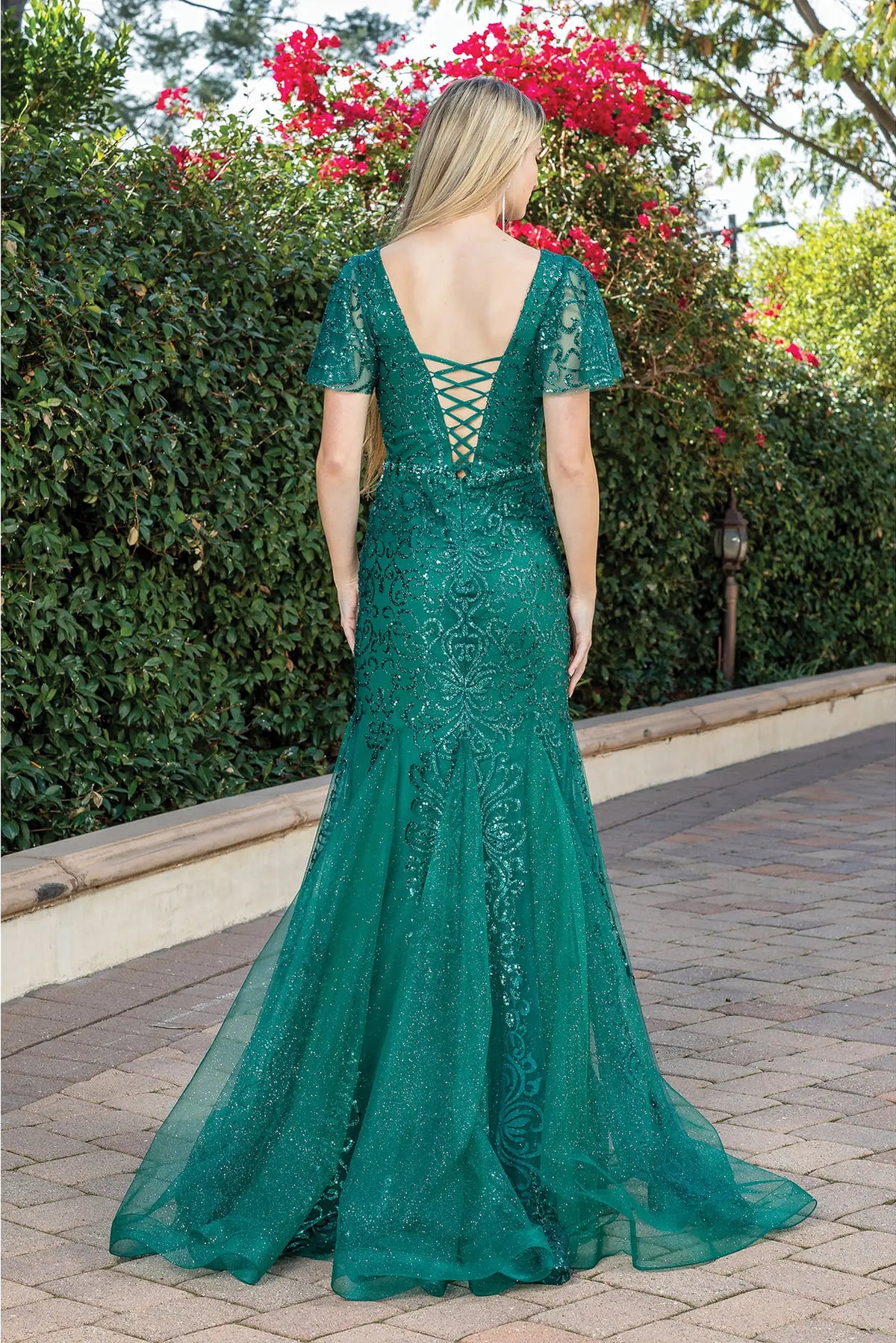 From the back, the Hunter Green prom dress reveals its floor-length skirt.