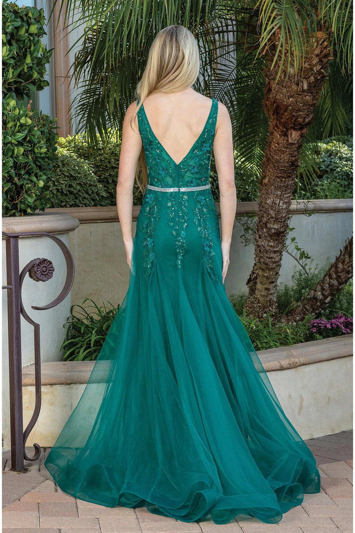 From the back, the Hunter Green prom dress reveals its floor-length skirt.