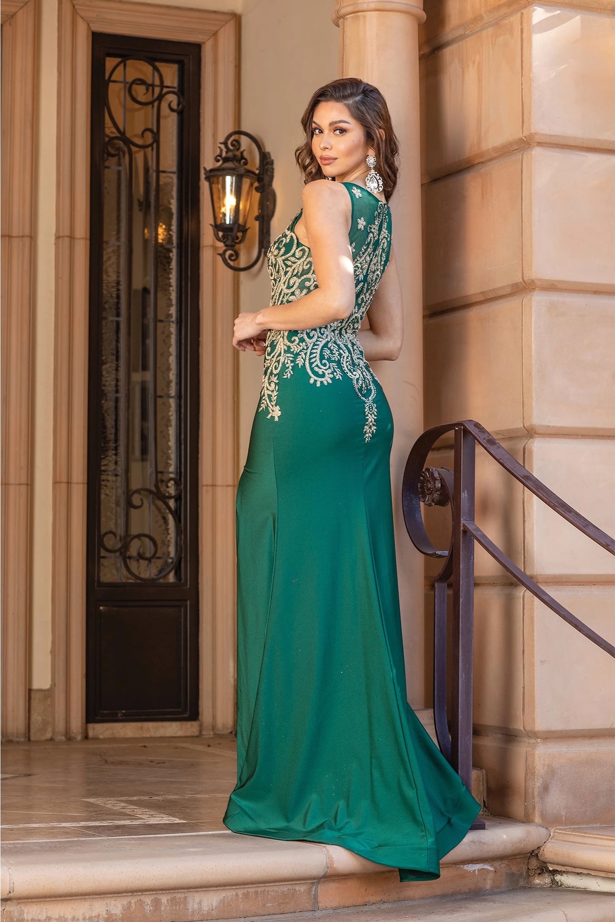 From the back, the Hunter Green prom dress reveals its floor-length skirt.