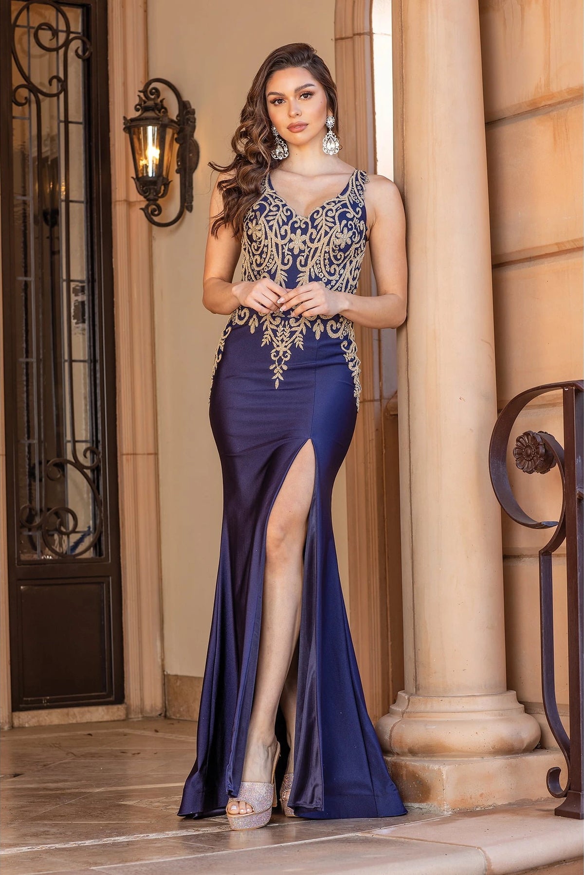 Featuring a floor-length skirt, this Navy prom dress is shown in full view.