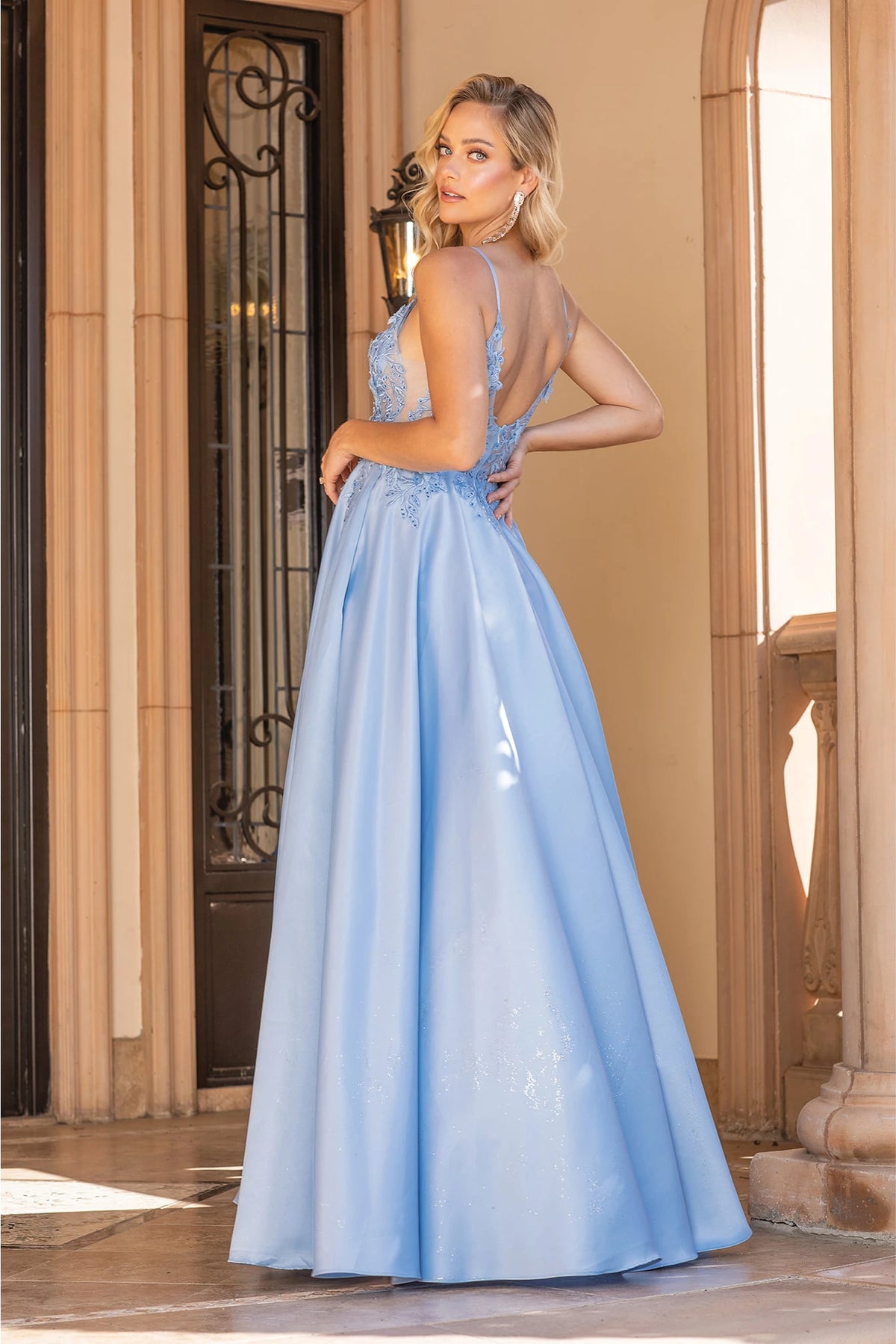 From the back, the Bahama Blue prom dress reveals its floor-length skirt.