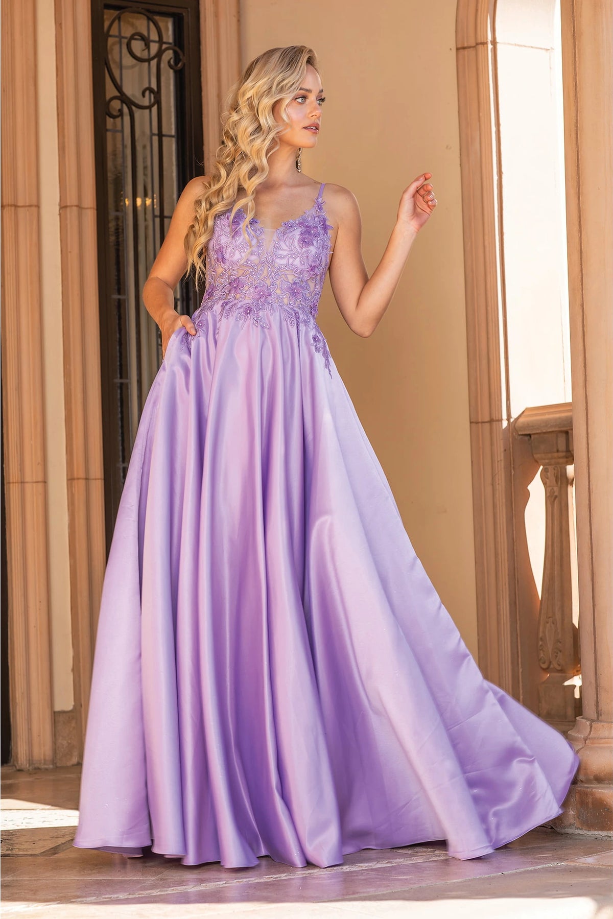 Featuring a floor-length skirt, this Lilac prom dress is shown in full view.