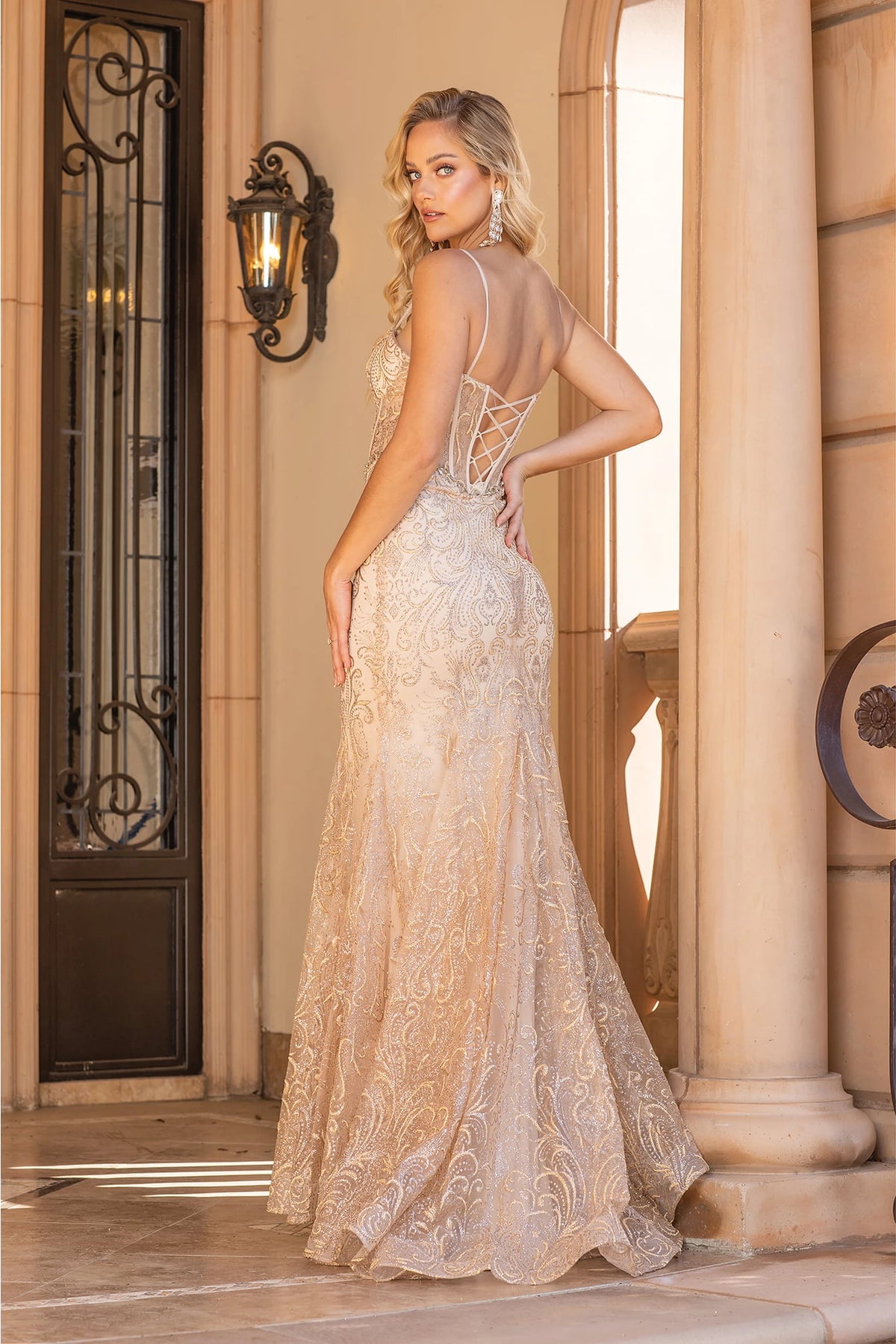 Showing its floor-length skirt, the Gold prom dress highlights the garment construction.