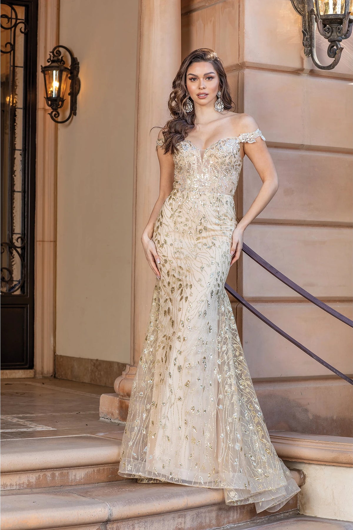 Featuring a floor-length skirt, this Gold prom dress is shown in full view.