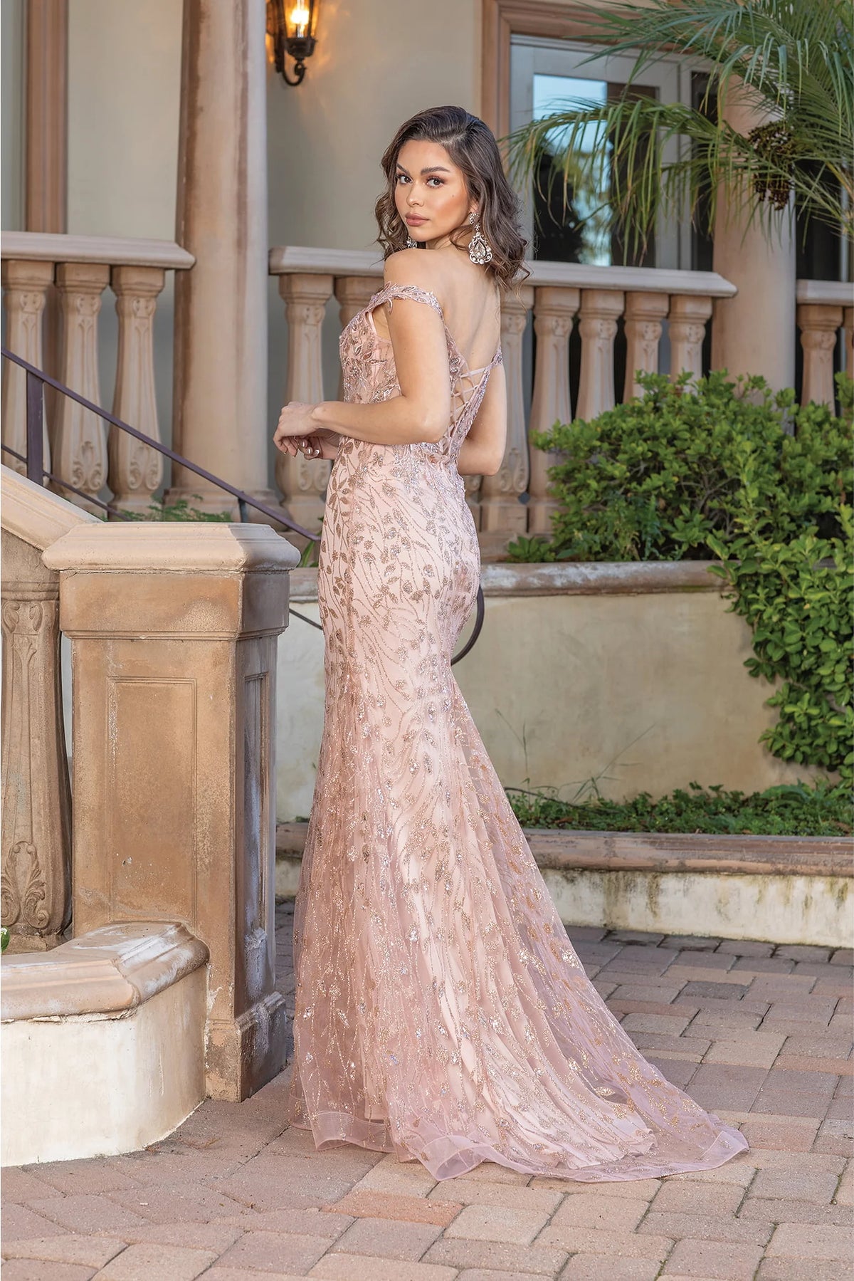 From the back, the Rose Gold prom dress reveals its floor-length skirt.