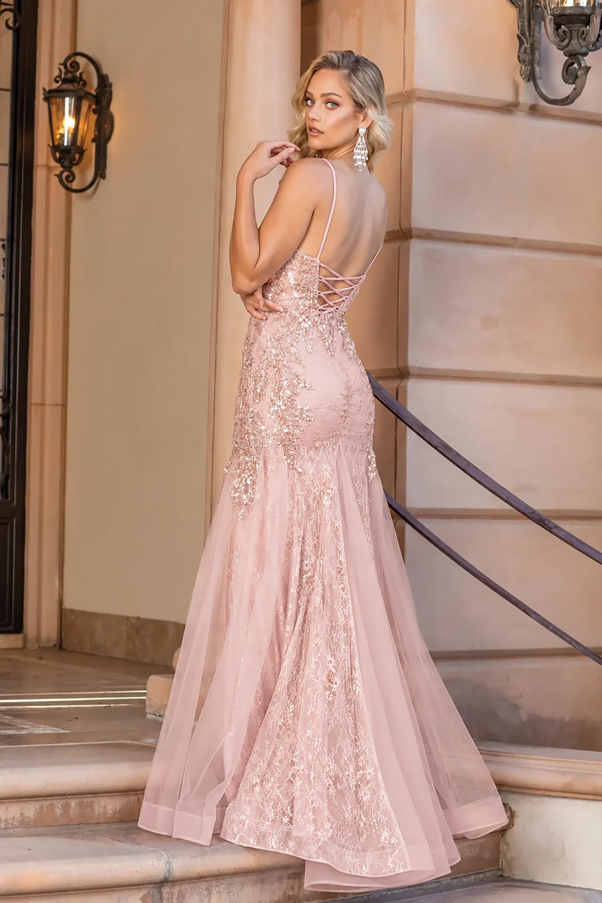 Low open back and sweeping skirt complete the Rose Gold Flowing Prom Dress.