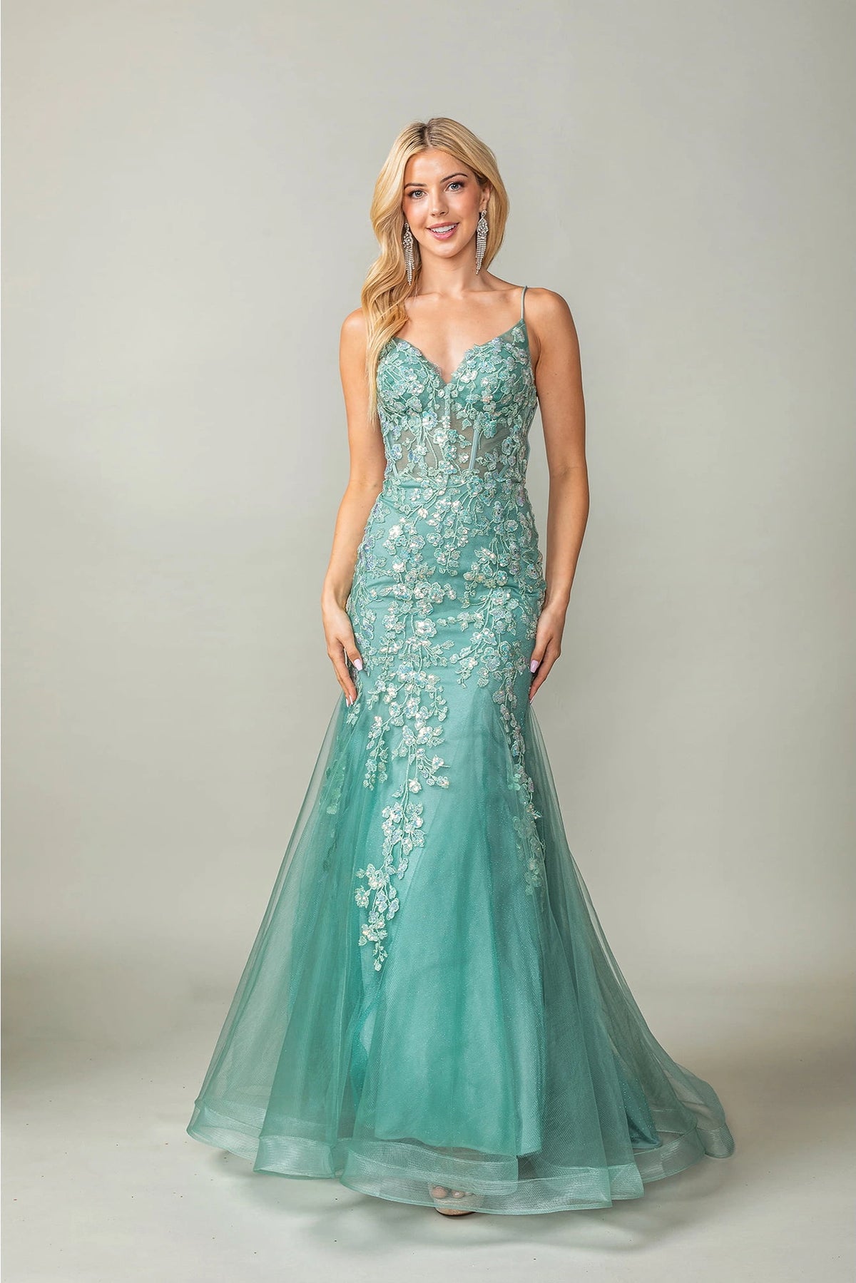 Featuring a floor-length skirt, this Sage prom dress is shown in full view.