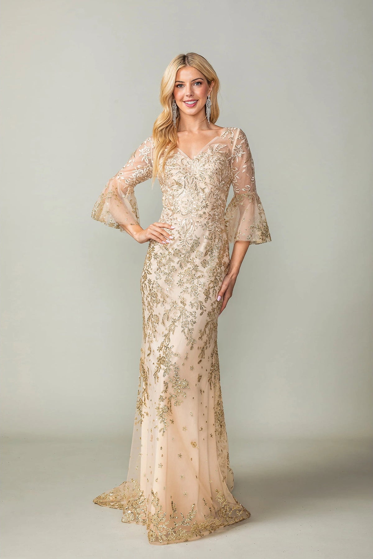 Featuring a floor-length skirt, this Gold prom dress is shown in full view.