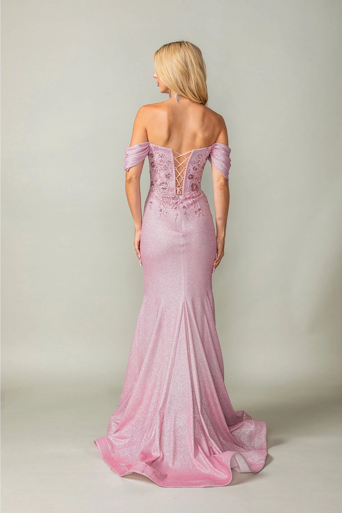 From the back, the Dusty Rose prom dress reveals its floor-length skirt.