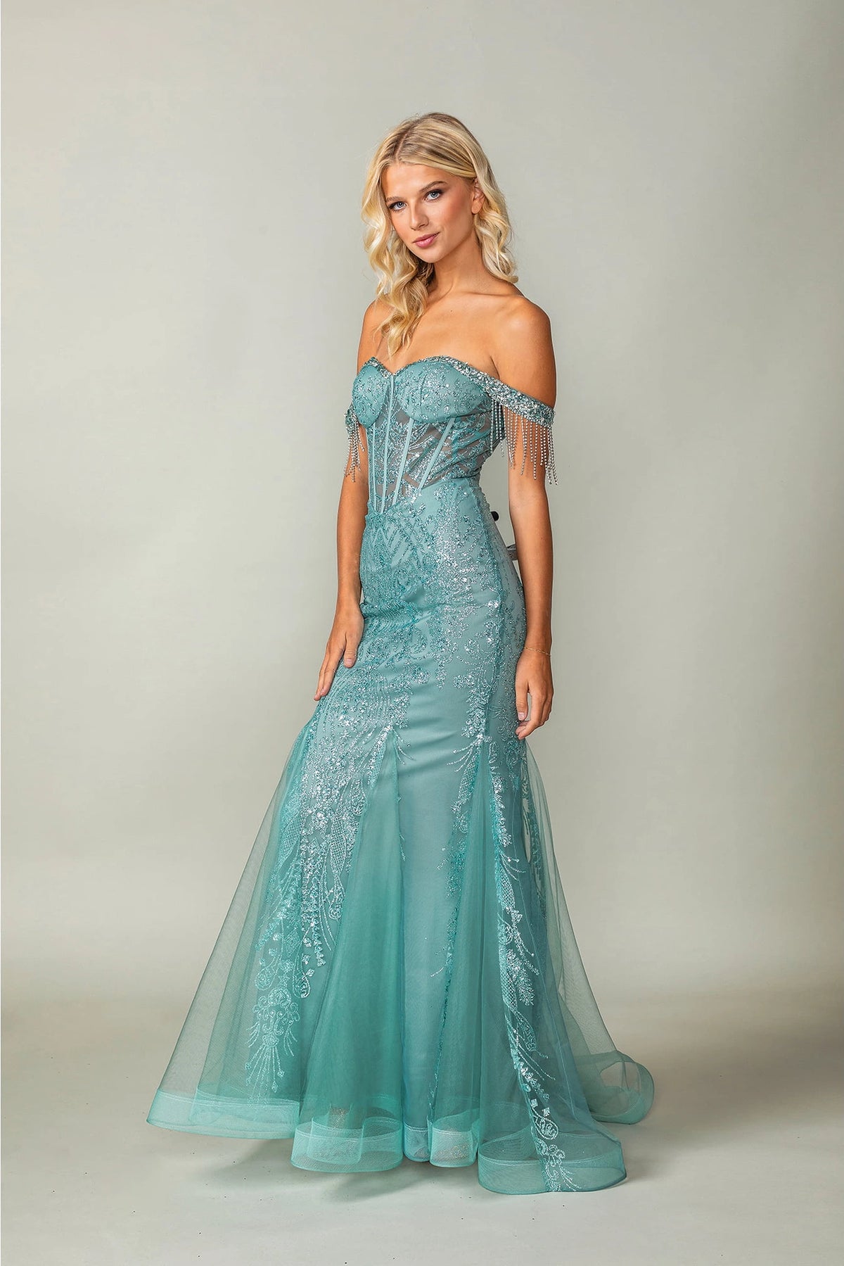 Featuring a floor-length skirt, this Sage prom dress is shown in full view.