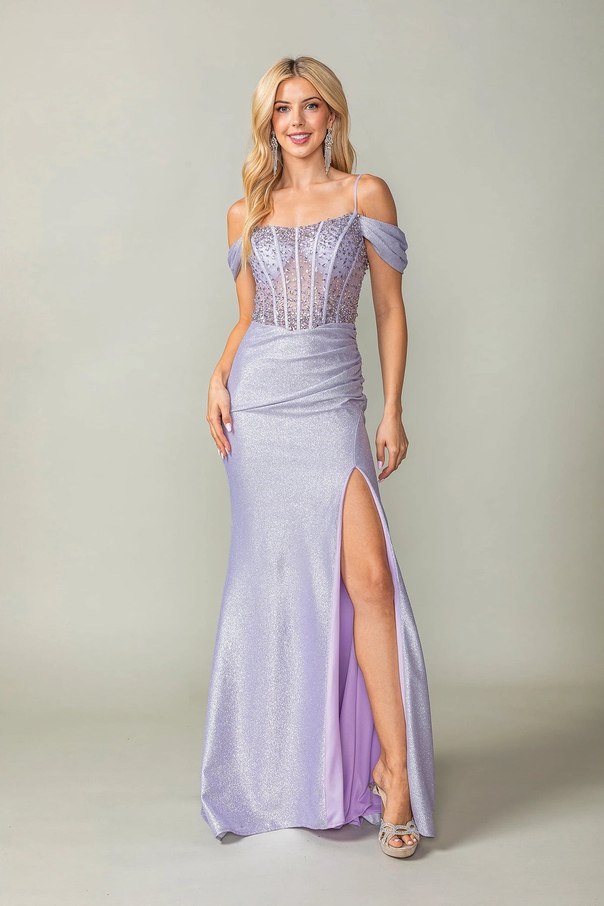 Featuring a floor-length skirt, this Lilac prom dress is shown in full view.