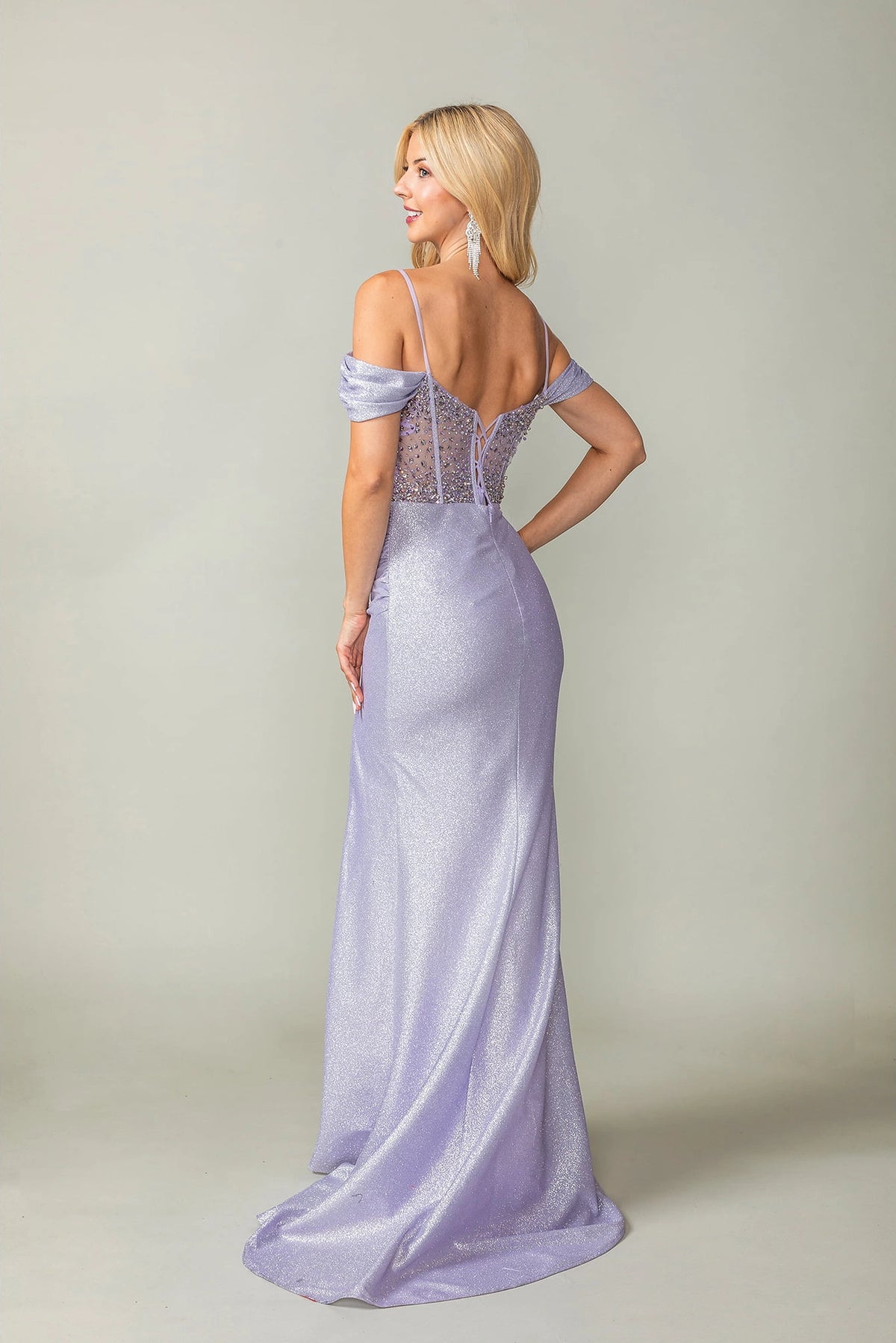From the back, the Lilac prom dress reveals its floor-length skirt.