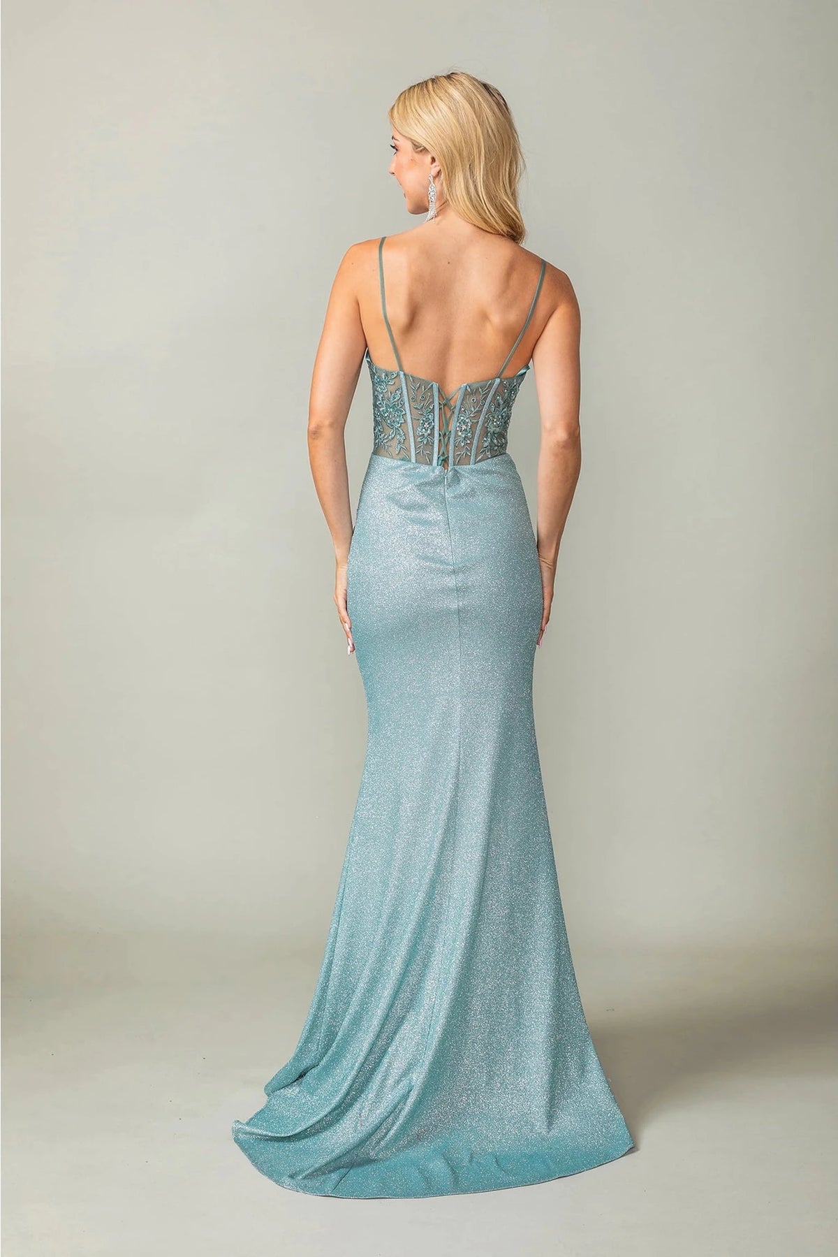 Showing its floor-length skirt, the Sage prom dress highlights the garment construction.