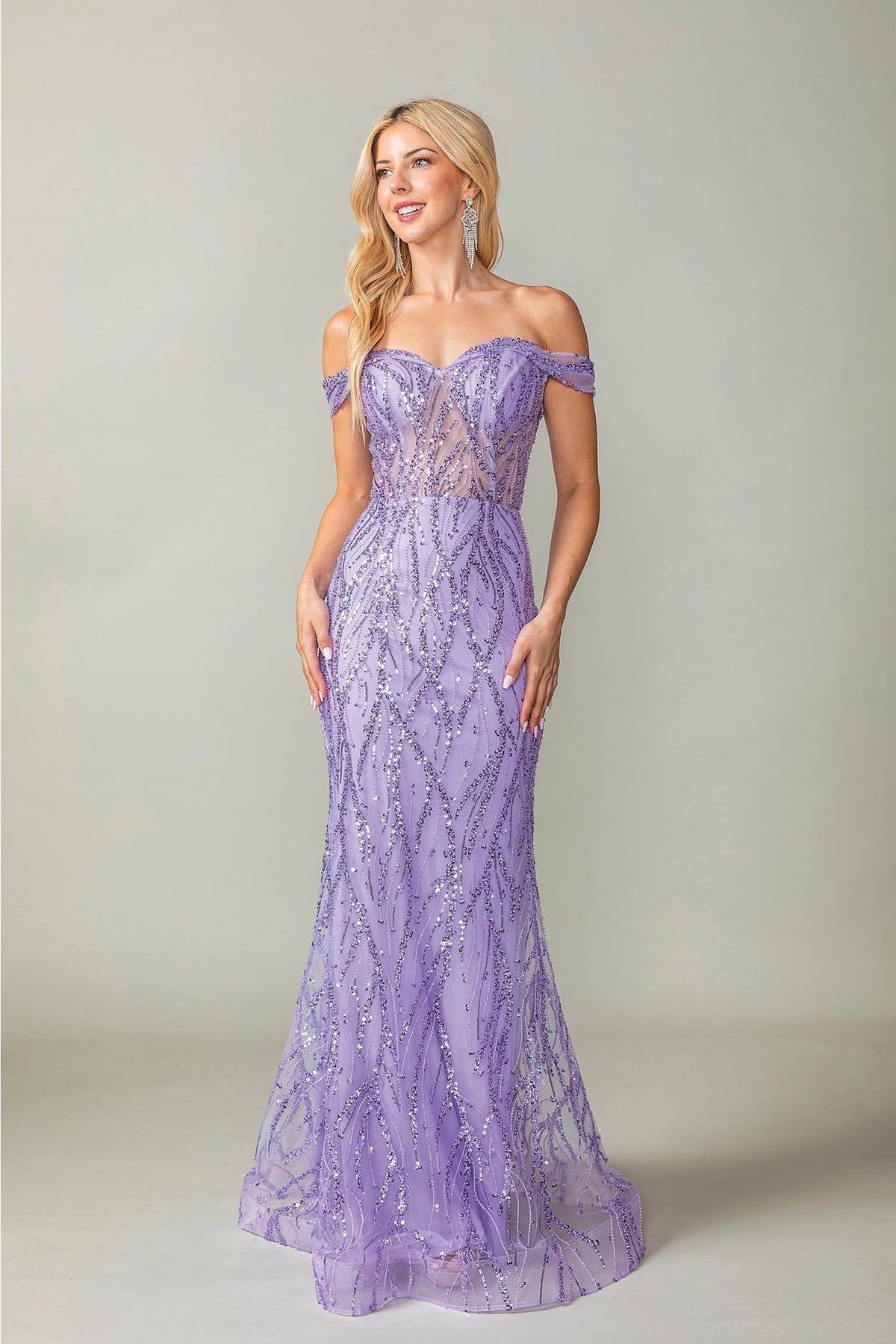 Featuring a floor-length skirt, this Lilac prom dress is shown in full view.