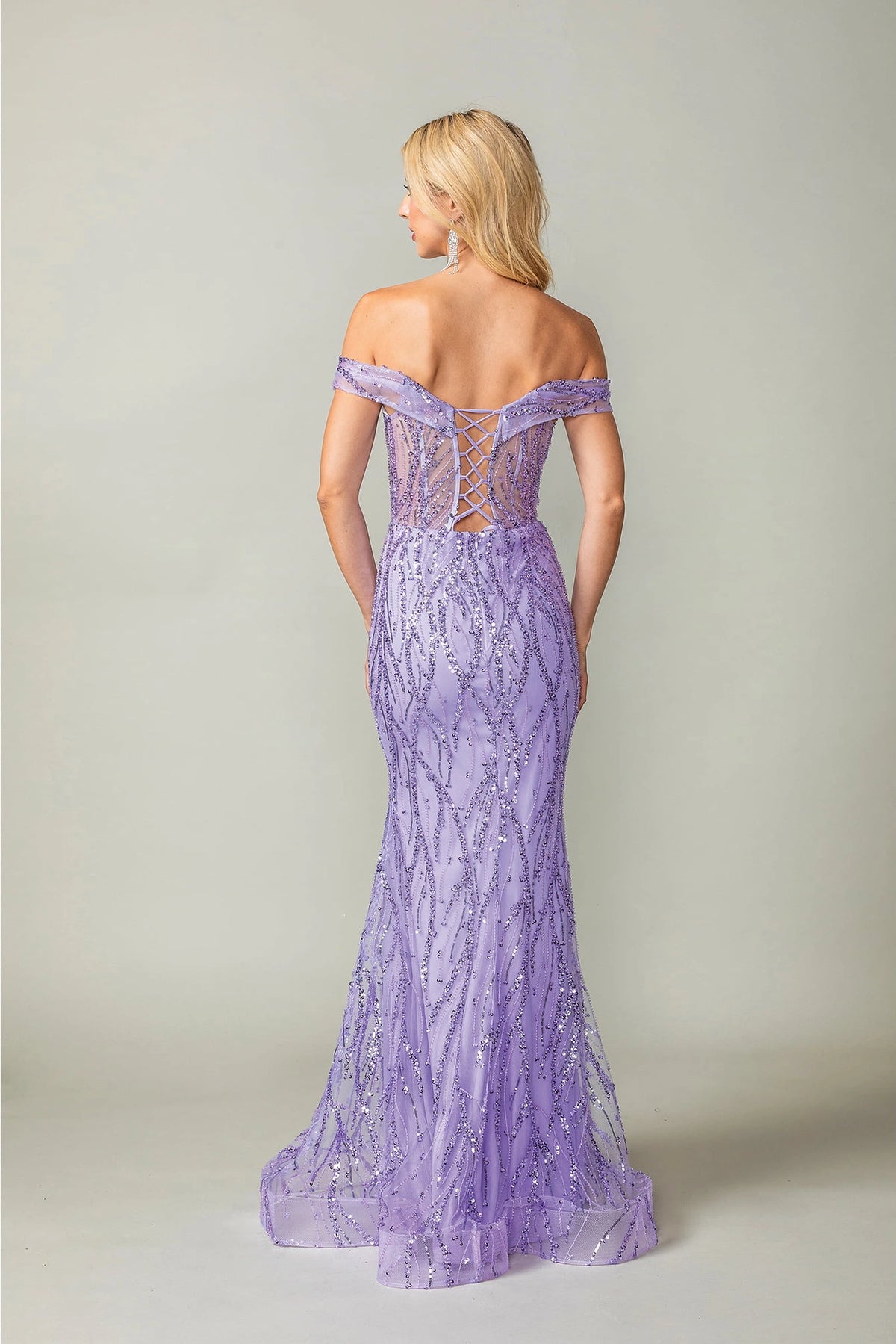 From the back, the Lilac prom dress reveals its floor-length skirt.