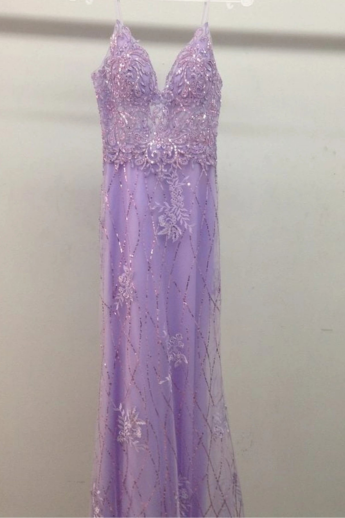 From the front, the Lilac prom dress reveals its floor-length skirt.