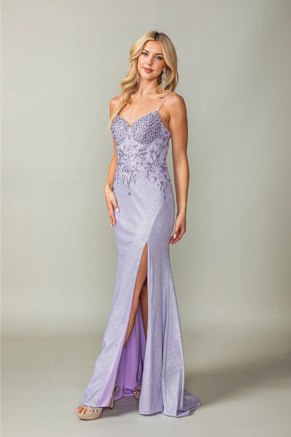 Featuring a floor-length skirt, this Lilac prom dress is shown in full view.