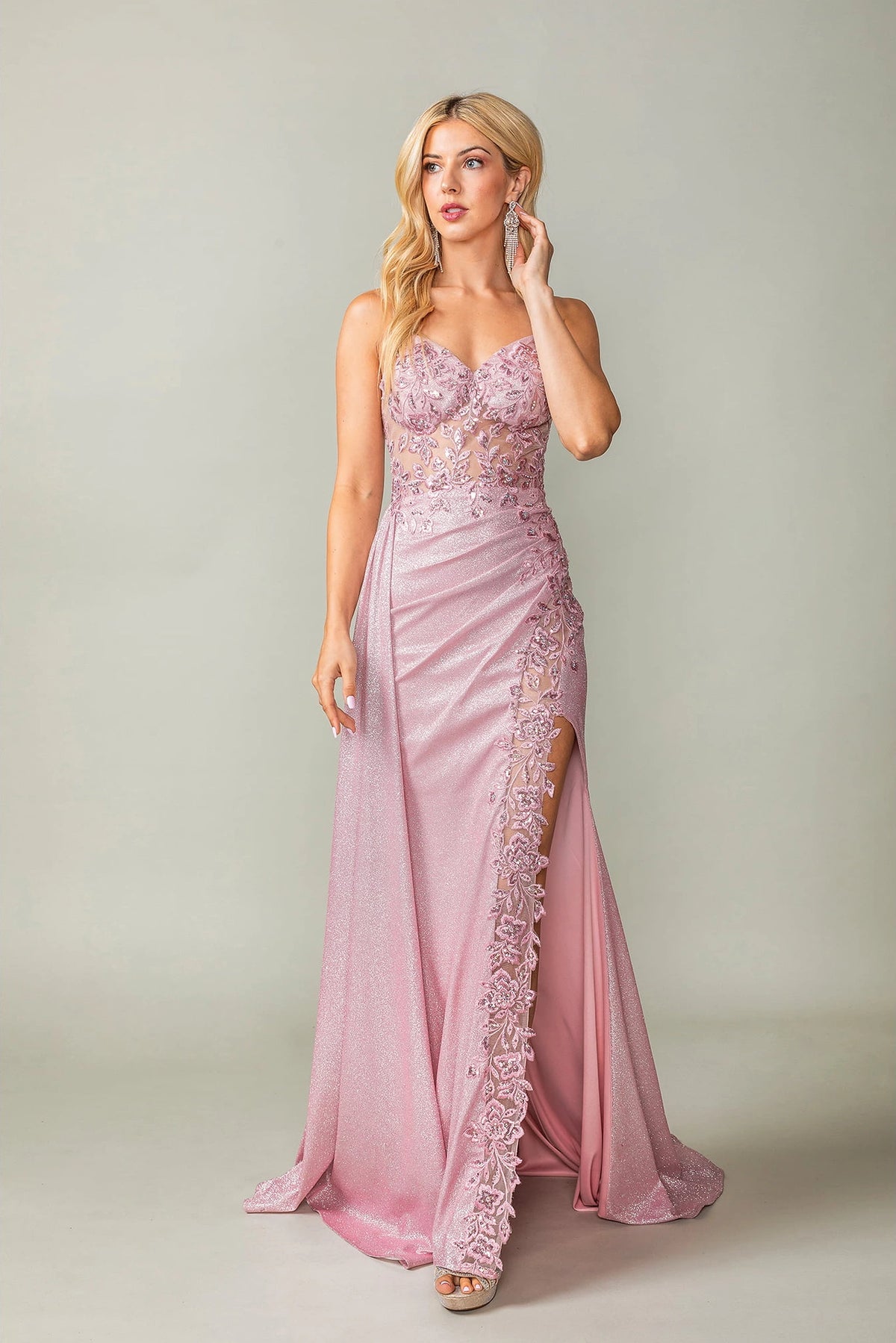 Featuring a floor-length skirt, this Blush prom dress is shown in full view.