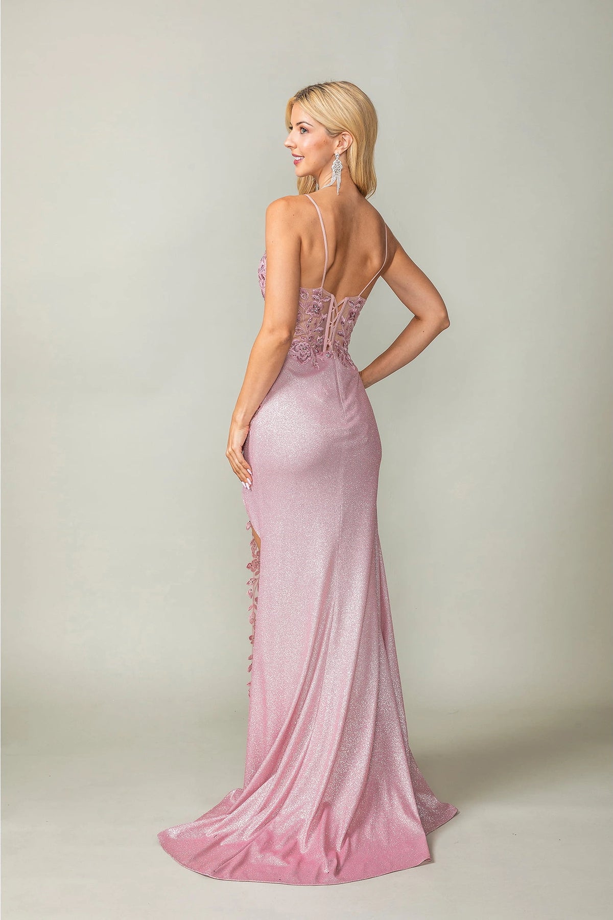 From the back, the Blush prom dress reveals its floor-length skirt.
