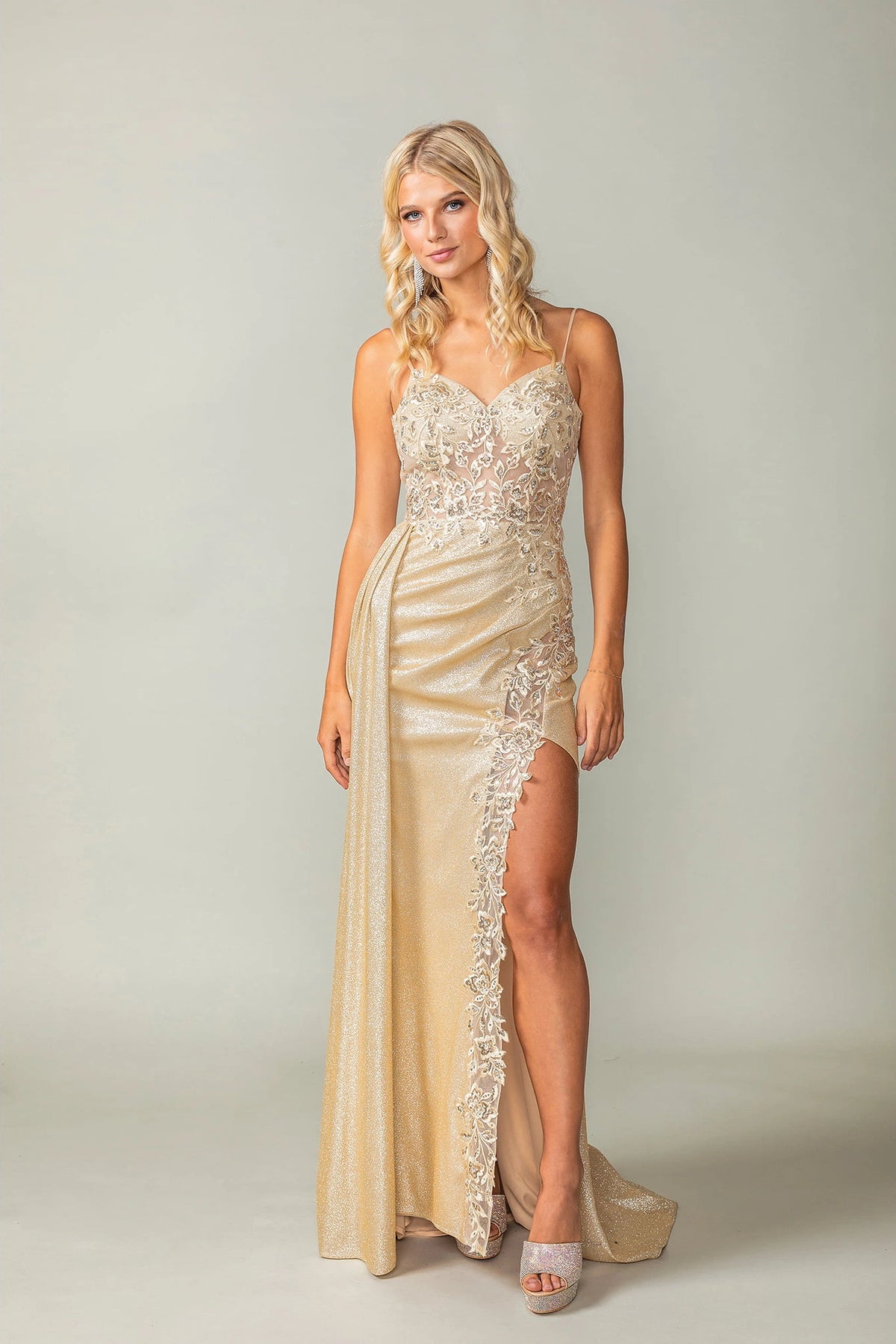 Featuring a floor-length skirt, this Champagne prom dress is shown in full view.