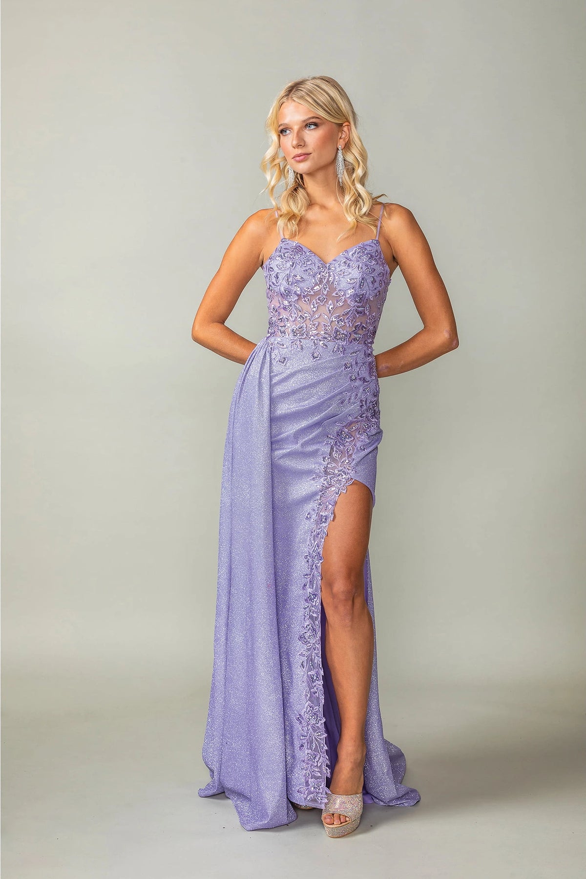 Featuring a floor-length skirt, this Lilac prom dress is shown in full view.