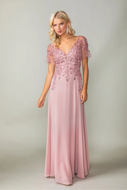 Woman in Dusty Blue prom dress with applique and flutter sleeves.