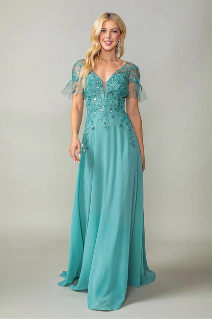 Woman in Sage prom dress with applique and flutter sleeves.
